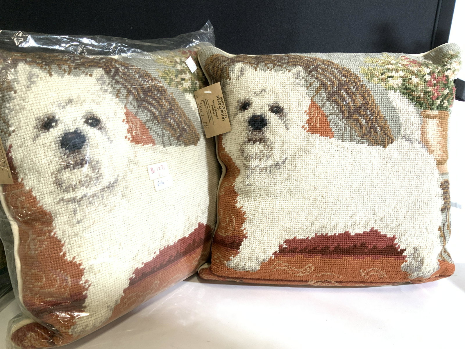 Pair Wool Needlepoint Westie Dog Pillows, NIP: Pair West Highland White Terrier Handmade Needlepoint pillows with original tag attached and wrapped in cellophane. Labeled Maker- Union Trading Co. , tag attached. plush beige. backside with zipper. 