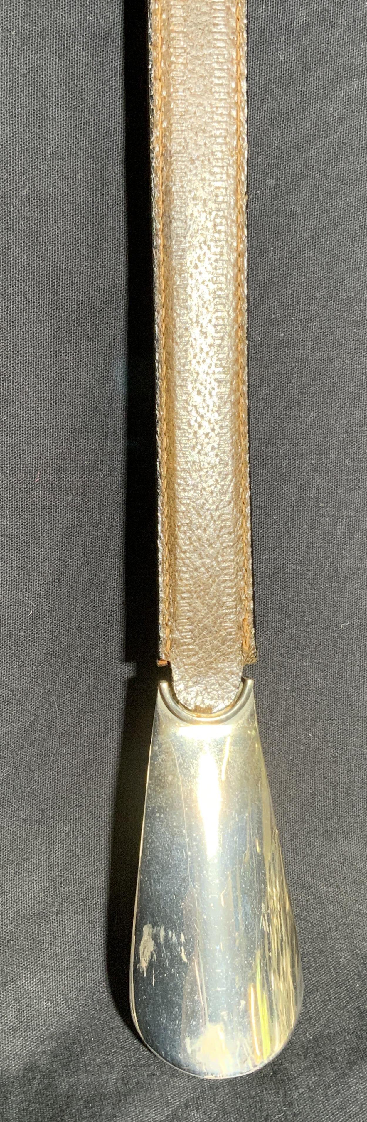 GUCCI Shoe Horn, Italy: Gucci shoe Horn, reads as GUCCI MADE IN ITALY. Handle is leather. Wear is consistent with age and use. Measures approx 22 inches long, 1.5 inches w. Shoe Horn, Italian accessories, shoe accessories, v