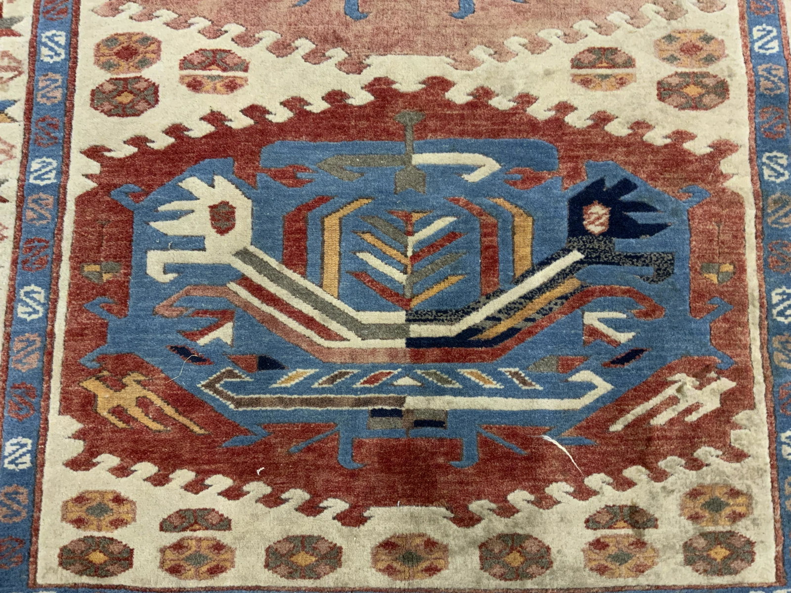 Persian Style Area Rug: Persian style area rug. Ends are fringed, wear to fringes. Decorated with multi toned medallion and geometric shapes. Wear is consistent with age and use. Measures approx 72 inches long, 40 inches w. 