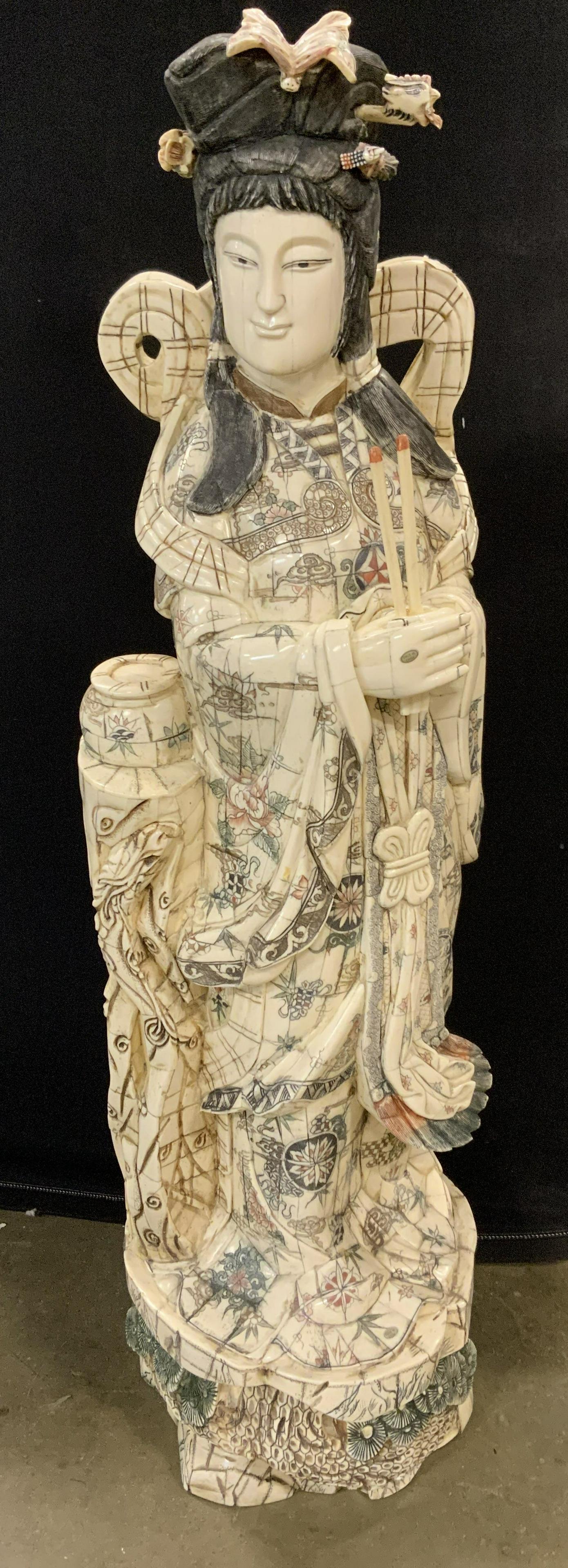 Bone & Wood Asian Floor Sized Sculpture 40 in H: Hand crafted bone tile on wood sculpture, Asian, possibly vintage. Hand etched detailing. Robes decorated with floral, and medallion patterns. Robed figure is grasping burning incense, flowing ribbons