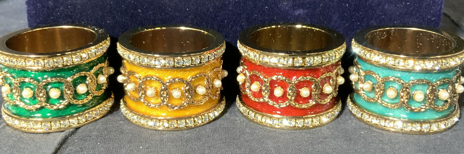 Collectible FABERGE Bejeweled Enamel Napkin Rings: New Never Used Faberge Napkin rings in blue velvet presentation box. A perfect gift for a person who loves to entertain and decorate the table. 4 Luxury French Guilloché Enameled Rings, set in a shin