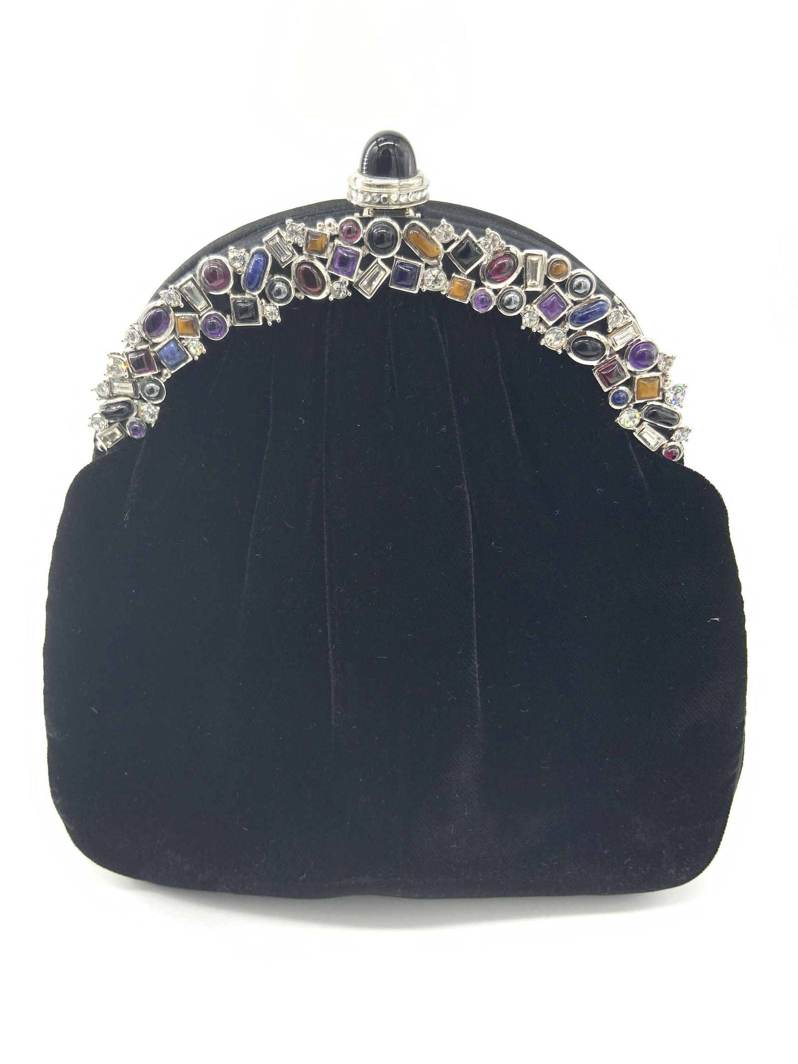 Vntg JUDITH LEIBER Black Velvet Purse W/ Tags: A vintage black velvet purse with a bejeweled accent along the obverse. Multi colored costume cabochons. Silver tone metal hardware. Black costume cabochon push and snap closure. Interior signed JUDIT