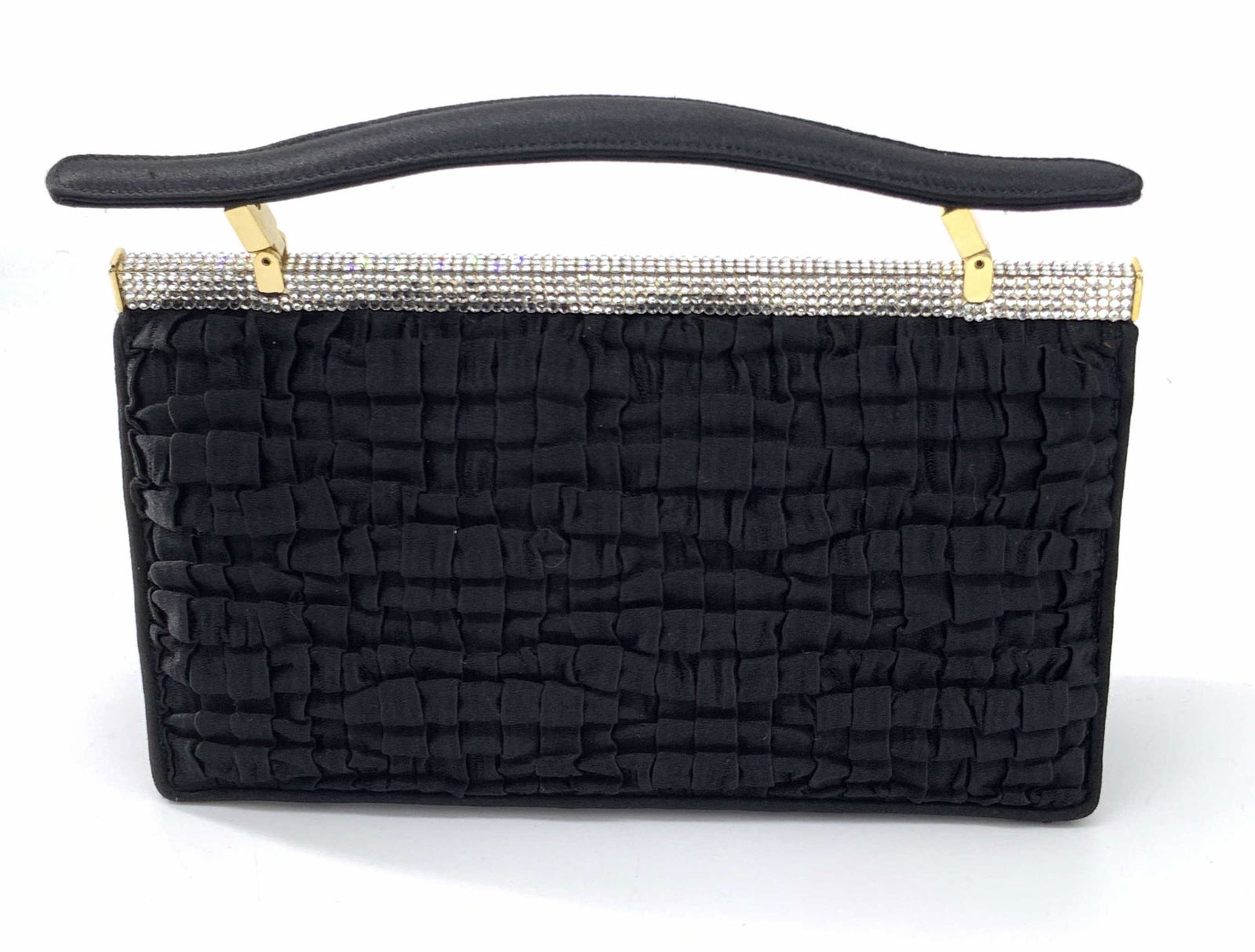 Vntg JUDITH LEIBER Ruffled Fabric Crystal Purse: A vintage black ruffled fabric purse that has bejeweled accents along its hardware. Gold tone metal hardware. Top handle is adjustable. Snap closure. Interior is lined with black fabric. Interior poss