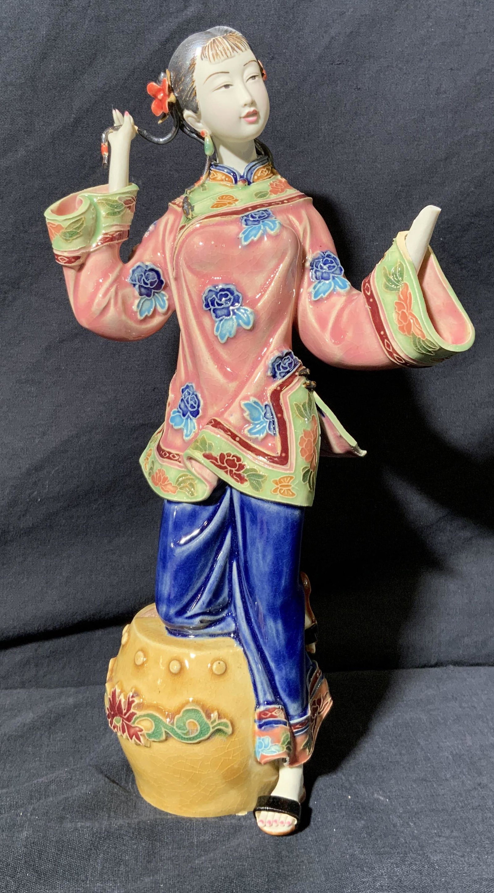 Standing Ceramic Eastern Asian Woman Figurine: Standing Ceramic Eastern Asian Woman Figurine, inscription to top of garden stool and inside of sculpture in eastern Asian characters, subject an young adult eastern Asian woman in traditional clothin