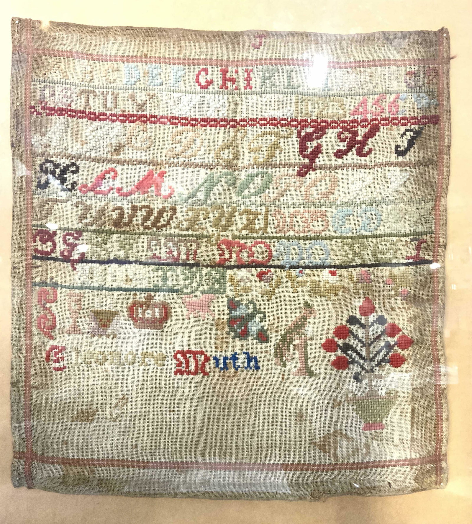 ELEONORE MIRTH Antique Alphabet Embroidery Sampler: ELEONORE MIRTH Antique Alphabet Embroidery Sampler, signature to lower left reads ‘ELEONORE MIRTH’, verso provides short biography of artist, subject an alphabet embroidery sampler from the 1830��
