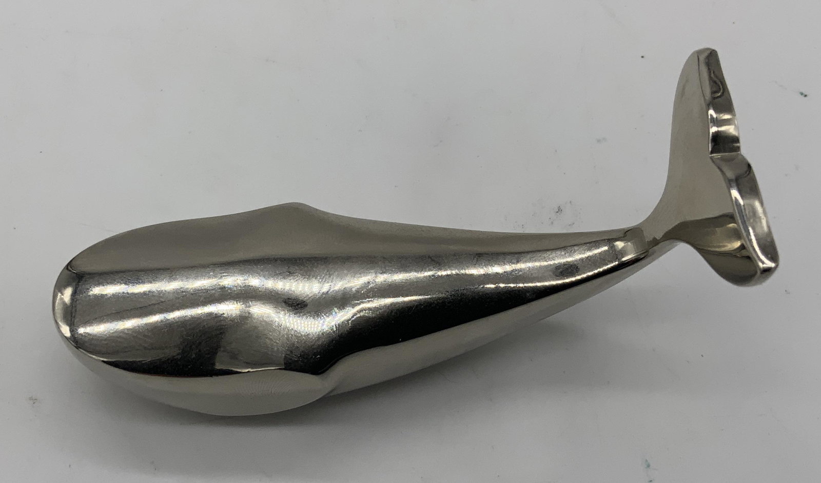 DANSK Metal Abstract Whale Figural: DANSK Metal Abstract Whale Figural, inscriptions to base read ‘Dansk Designs Japan’, 3 in long, 1 in wide, 1 in tall. surface wear to piece Dansk Metal abstract whale figural, Dansk, Japanese, abs