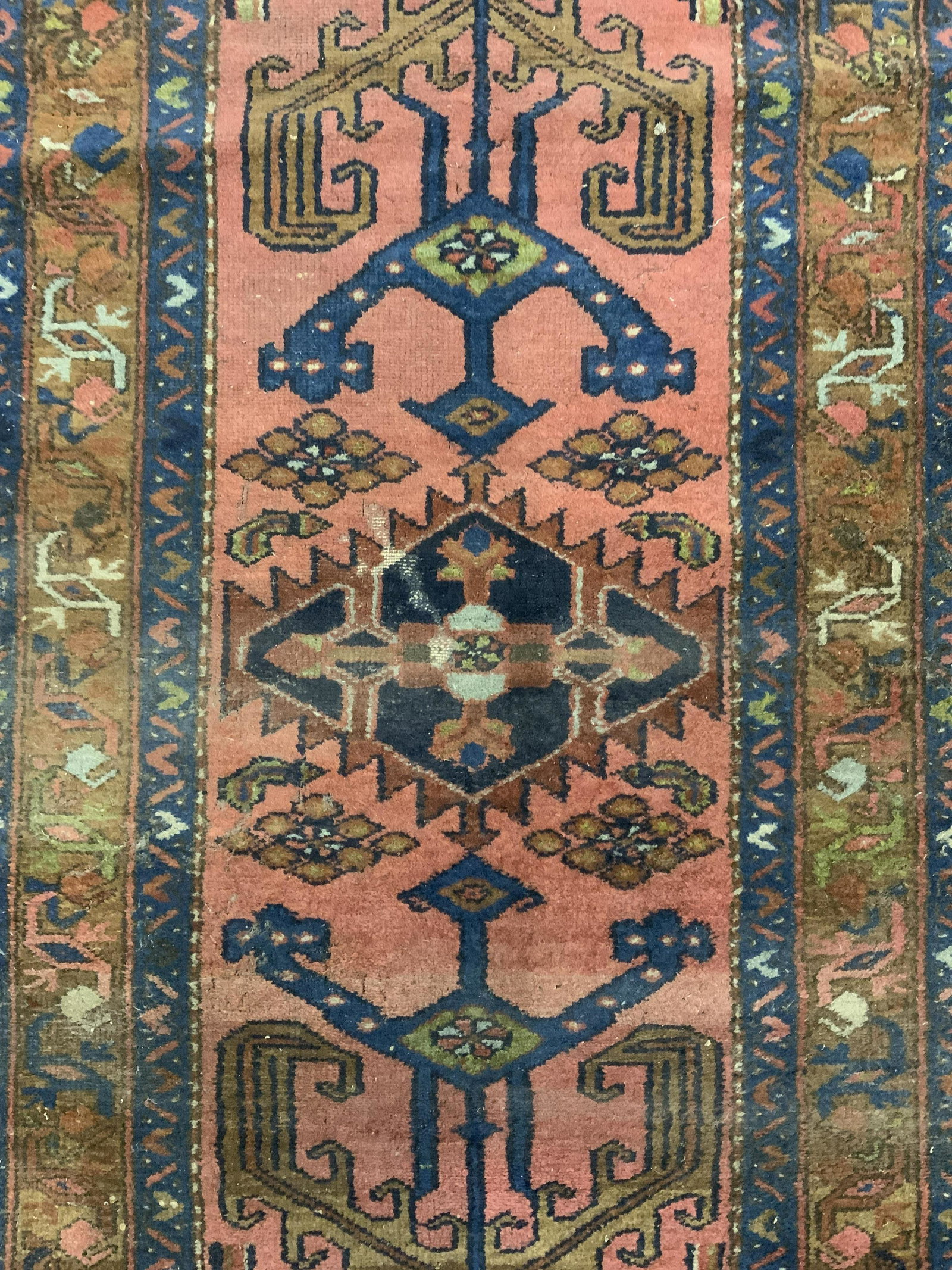 Vintage Handmade Wool Area Rug: Rug is handmade and wool. Piece is vintage possibly antique. Rug contains intricate multi toned geometric detail. Piece measures approx 60 inches long 34 inches wide. Rug, carpet, wool rug, handmade r