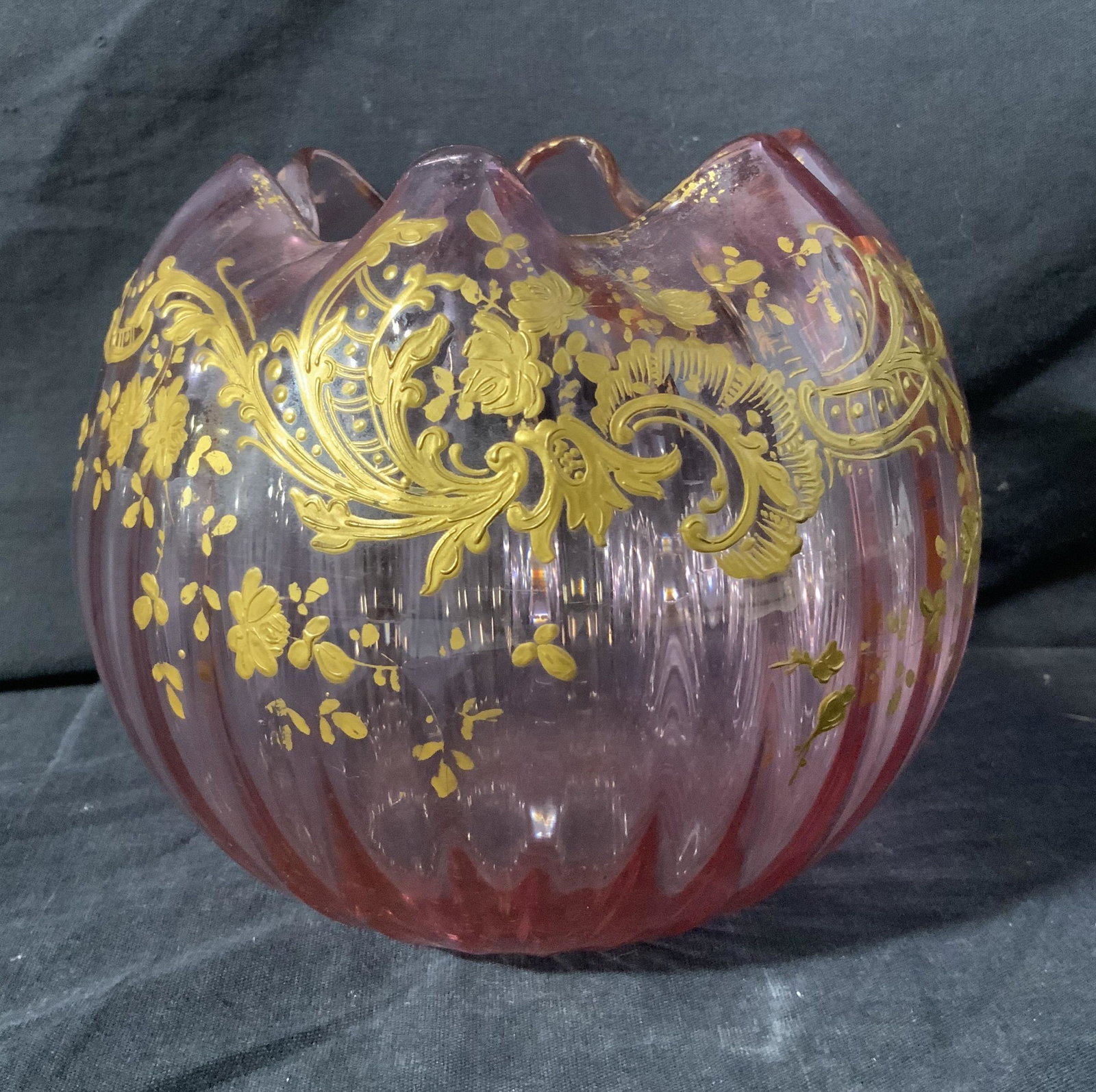 Pink Toned Glass Bowl w Gold Toned Gilt Paste Up: Pink Toned Glass Bowl w Gold Toned Gilt Paste Up, no apparent inscriptions or marks to piece, ribbed glass pink toned bowl with gold toned gilt paste up in floral design, measures 5 1/2 x 6 x 6 inches