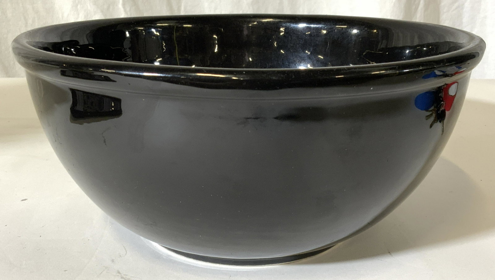 GAETANO POTTERY Black Porcelain Bowl: Underside of piece reads GAETANO POTTERY. Piece is black toned and porcelain. Bowl measures approx 10.5 inches wide 5 inches tall. Bowl, porcelain bowl, black bowl, fruit bowl, GAETANO pottery. 6