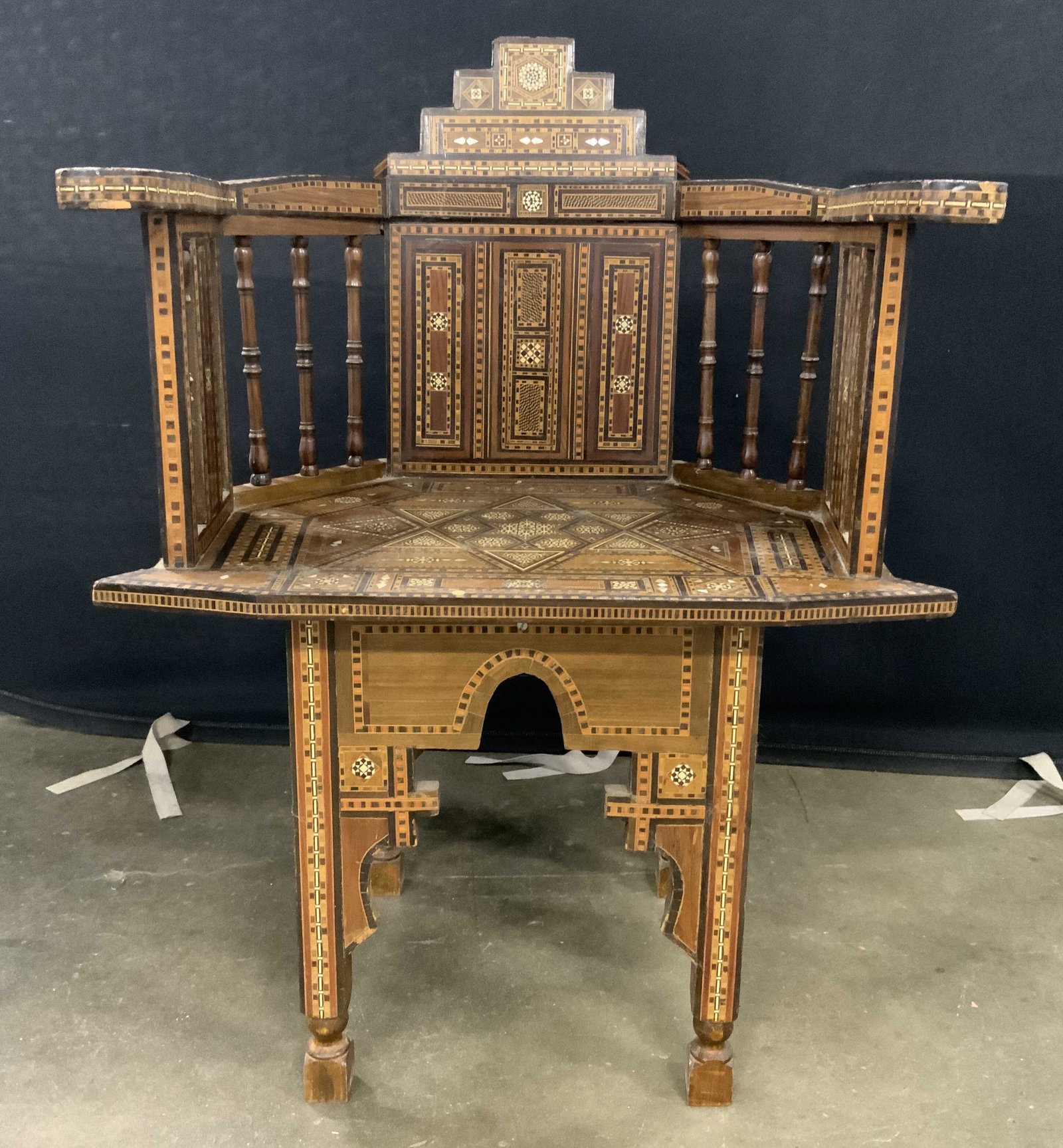 Turkish Inlaid Wood & Mother Of Pearl Chair: Chair appears to Turkish possibly Syrian. Chair has intricate wood & mother of Pearl inlay detail. Chair has armrests. Measures approx 33 inches tall 23 inches wide 21 inches deep. Chair, vintage chai