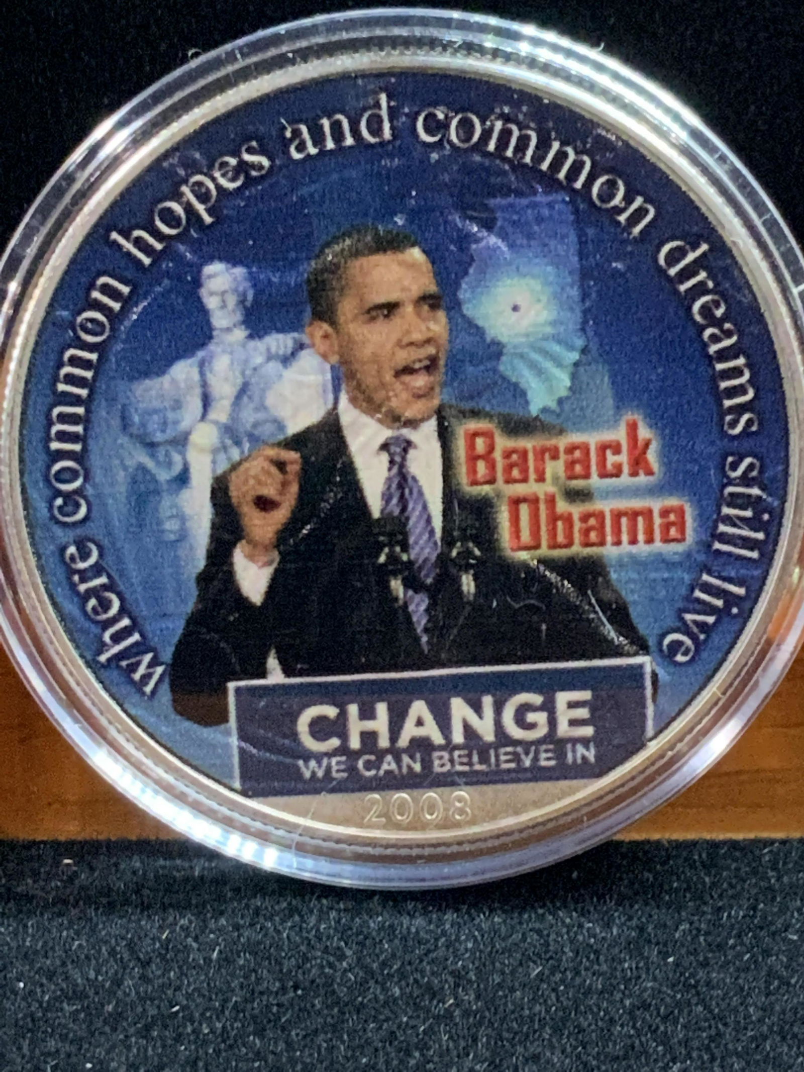 BARACK OBAMA Presidential Silver Dollar in Box: C. 2008 United States Silver dollar with American Eagle, reads ‘1 oz. Fine Silver- One Dollar- United States of America’ . Other side has sticker on coin with President Obama’s Picture and campa