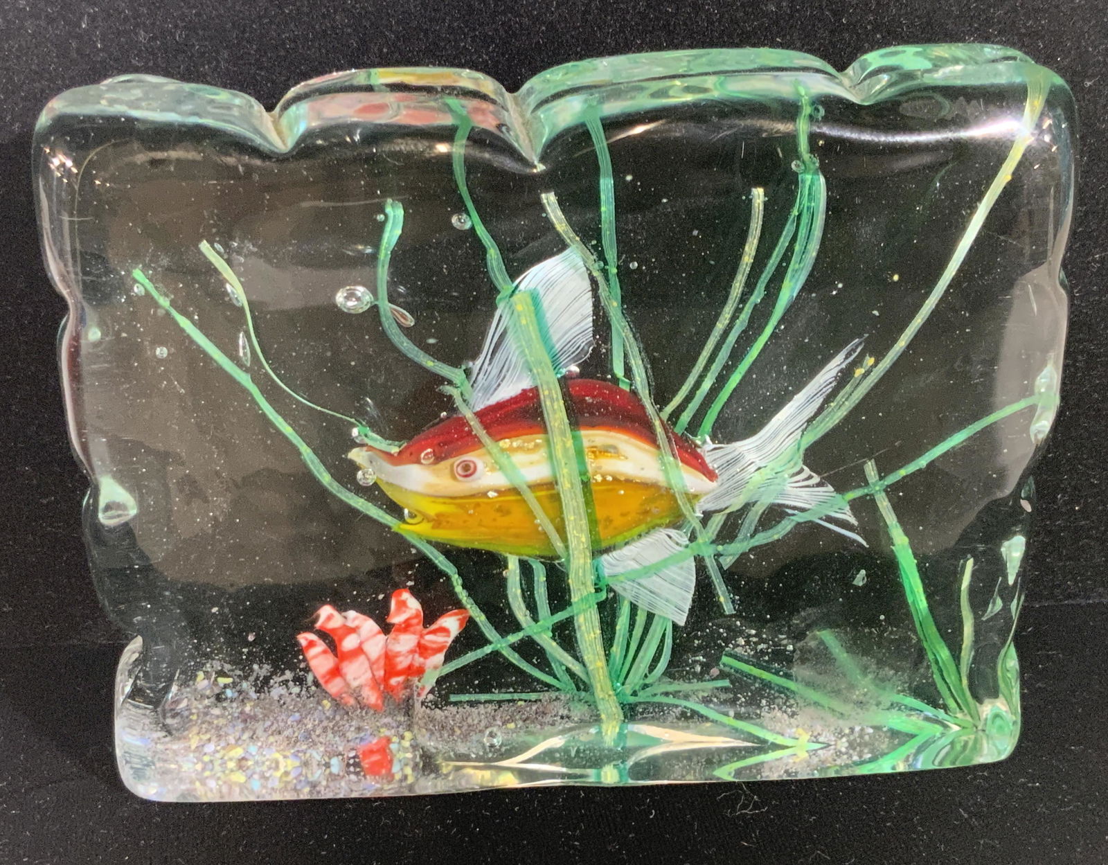 Vintage Art Glass Aquatic Motif Paperweight: A rectangular colorless glass paperweight with interior glass designs depicting a colorful aquatic motif. A fish swings amongst coral and algae. Thick walled and weighty. Measures approx 4.5H x 5.5W i