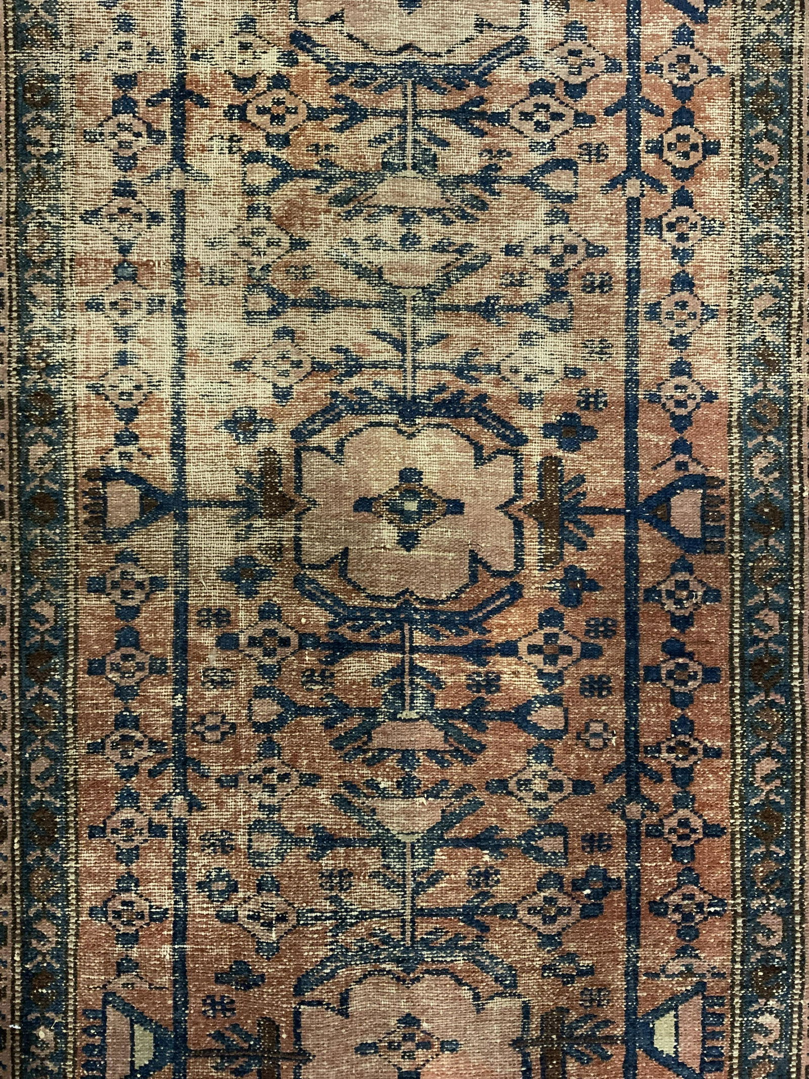 Vintage Handmade Persian Wool Area Rug: Rug is wool and handmade. Piece is vintage possibly antique. Rug contains intricate multi toned floral, vine, leaf & geometric detail. Piece measures approx 69 inches long 39 inches wide . Rug, carpet