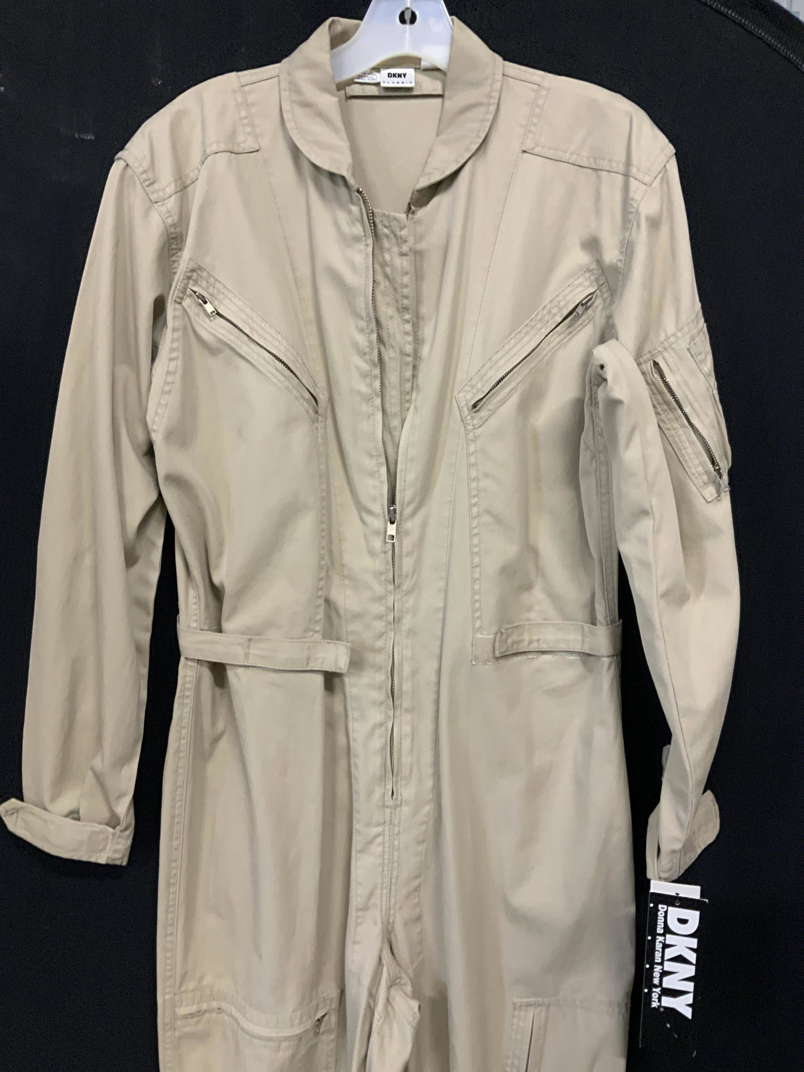 NWT DKNY JEANS COTTON COVERALLS: Tan cotton one piece, new old stock with tags, Donna Karen New York , Size Large, inseam 28.5 in. Zipper pockets all over. Velcro cinch waste for style. Total length app 59 in. Signed Designer, DKNY,