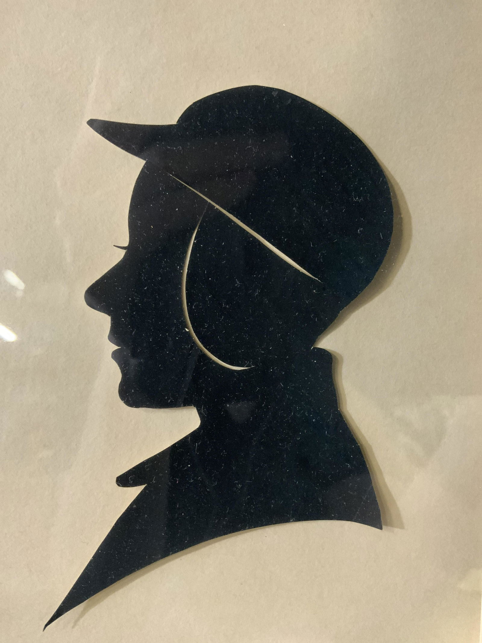 Profile Portrait Silhouette Cutout Framed Artwork: Profile Silhouette Cutout Framed, no apparent inscriptions or mark to piece, subject a black profile silhouette cutout with hat, frame measures 9 x 11 inches, window measures 4 1/2 x 6 1/2 inches, fra