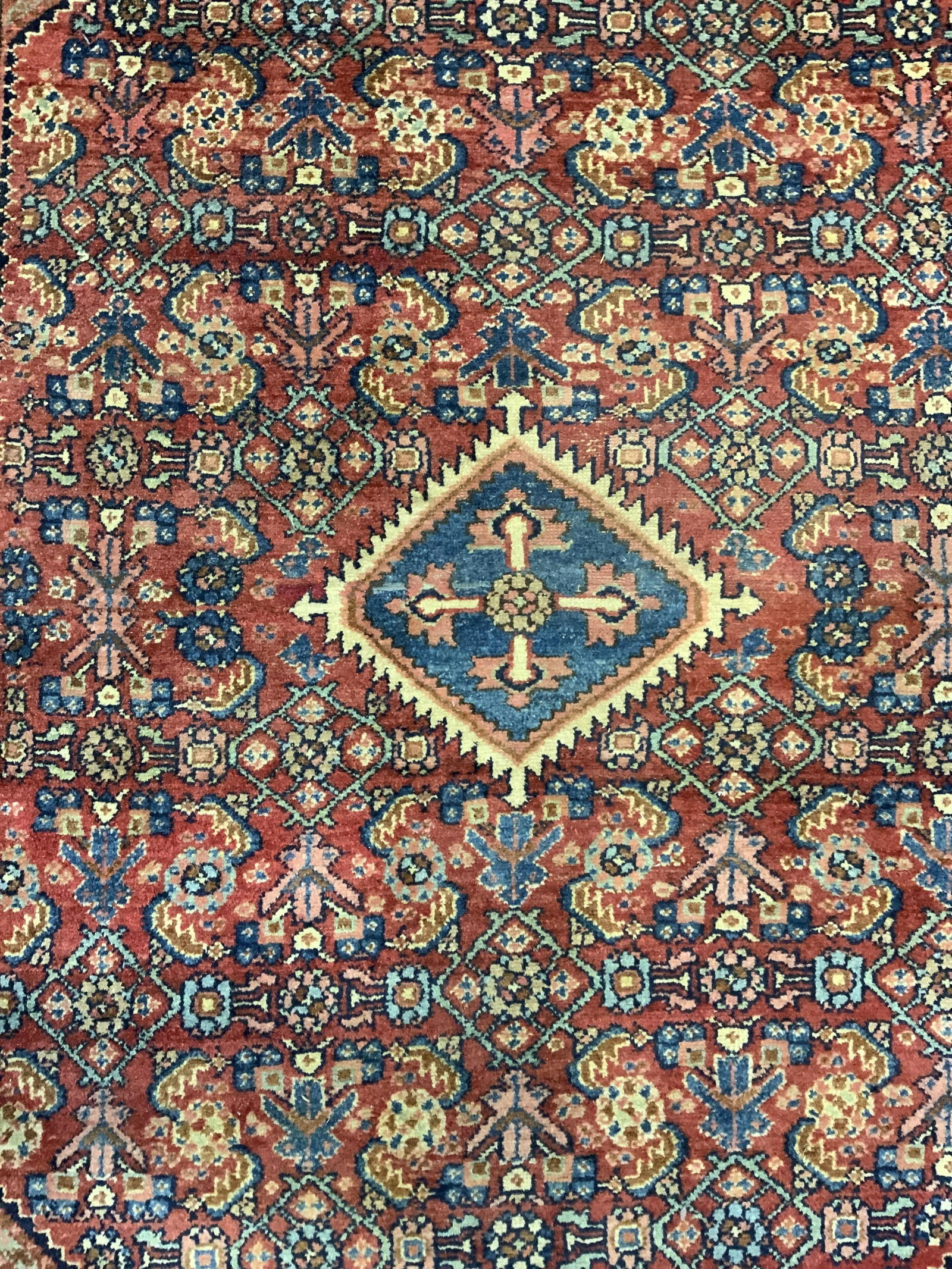Vintage Handmade Persian Wool Area Rug: Rug is handmade & wool. Piece is vintage possibly antique. Rug contains intricate multi toned floral, vine, leaf & geometric detail. Piece measures approx 84 inches long 57 inches wide. Rug, carpet, w
