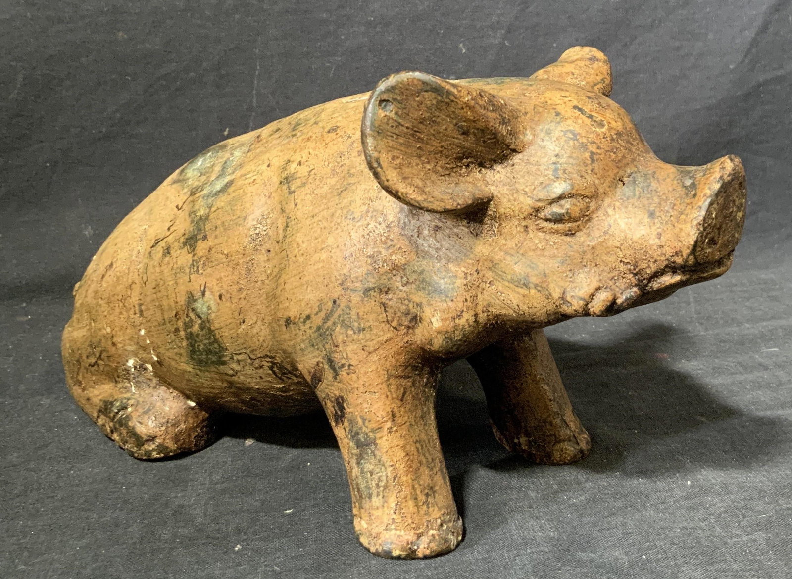 Antique Cast Metal Pig Figurine: Antique Cast Metal Pig Figurine, no apparent inscriptions to piece, measures 10 1/2 l x 4 w x 5 1/2 h inches, shows pig resting on hind legs, wear consistent with age and use. Artwork, home decor, tab
