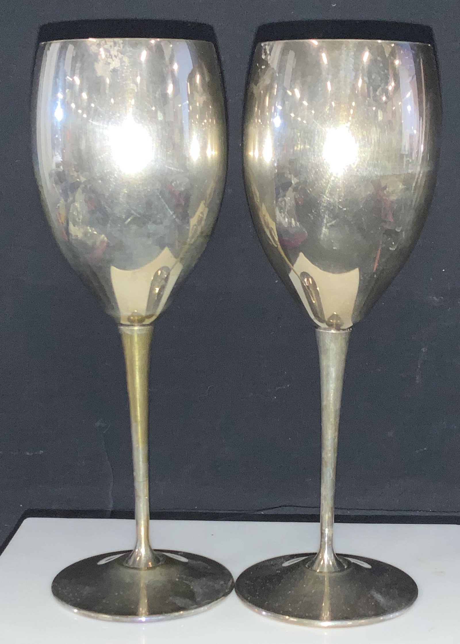 EL De UMBERTI Silver Plated Pr Wine Goblets, Italy: Hallmarked Wine glasses, silver plated, luxury Italian brand EL DE UMBERTI. 8 in. Ht, 3 in. Width, traditional stemware, Has surface wear consistent with use, age and exposure, possibly tape residue, 