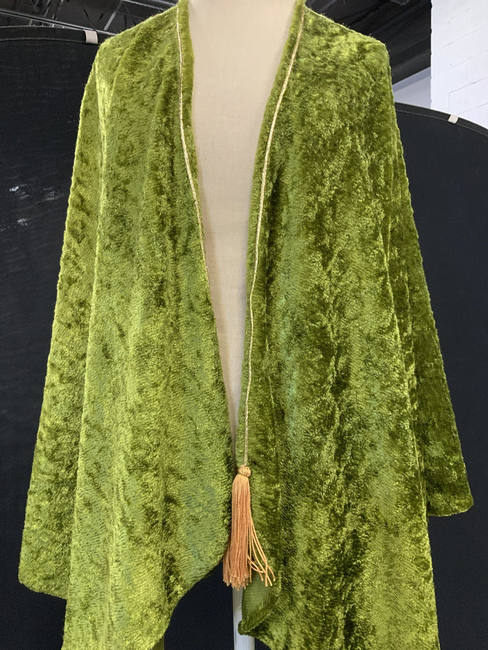 Gypsy Handmades Green Plush Fall Fashion Cape: Labeled vintage Designer Gypsy Handmades, Rounded shoulder cape with plush fabric, a shiny moss green. From neck measures 29.5 in. Long. Decorative gold tassel along shawl collar hem. ladies Luxury vi