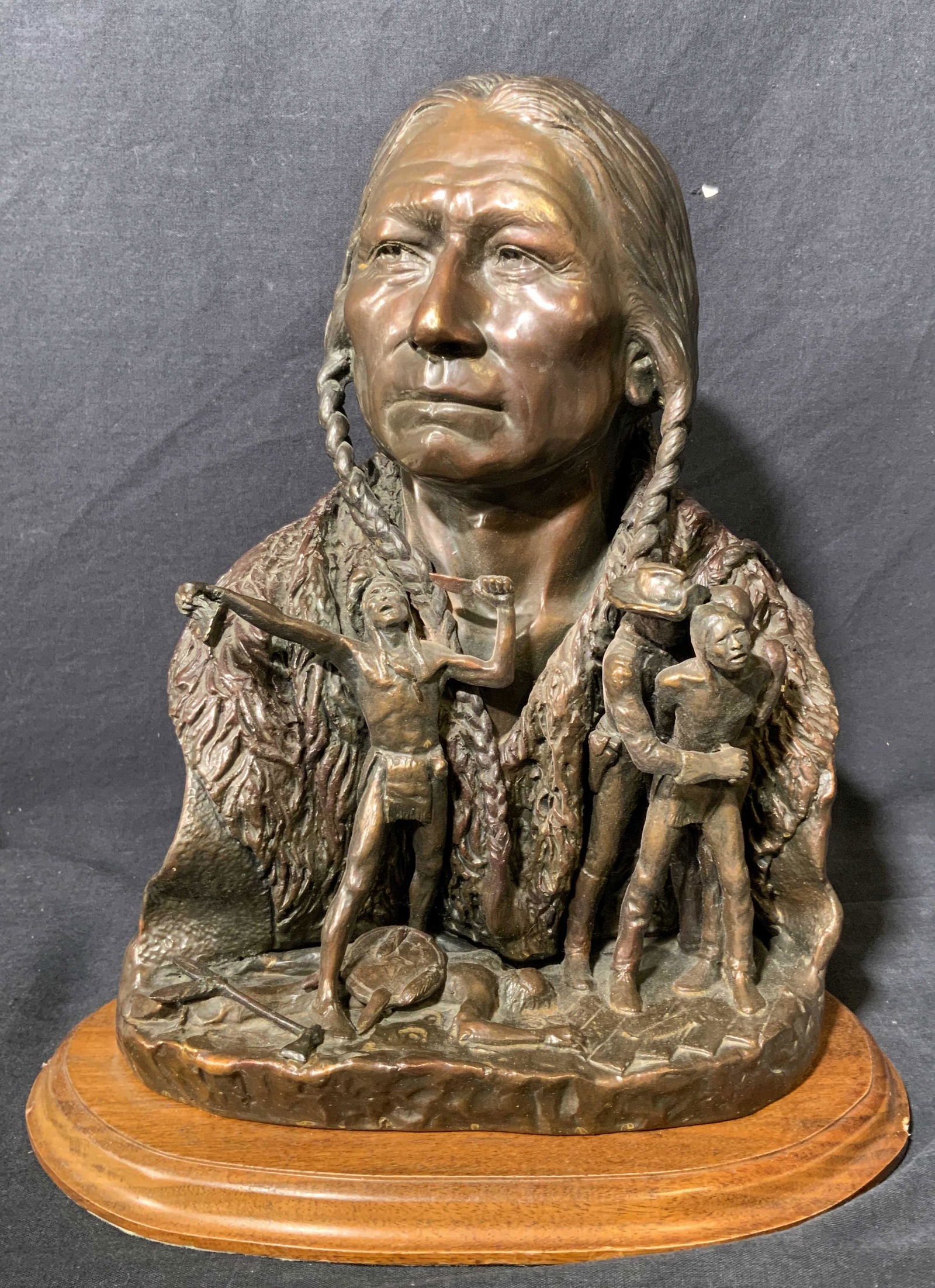 THOMAS SCOTT MORRIS Bronze Bust of Native American: THOMAS SCOTT MORRIS Bronze Bust of Native American, signature to base reads ‘Thomas Scott Morris’, subject a bust of a Native American with full figures one getting stabbed and the other screaming