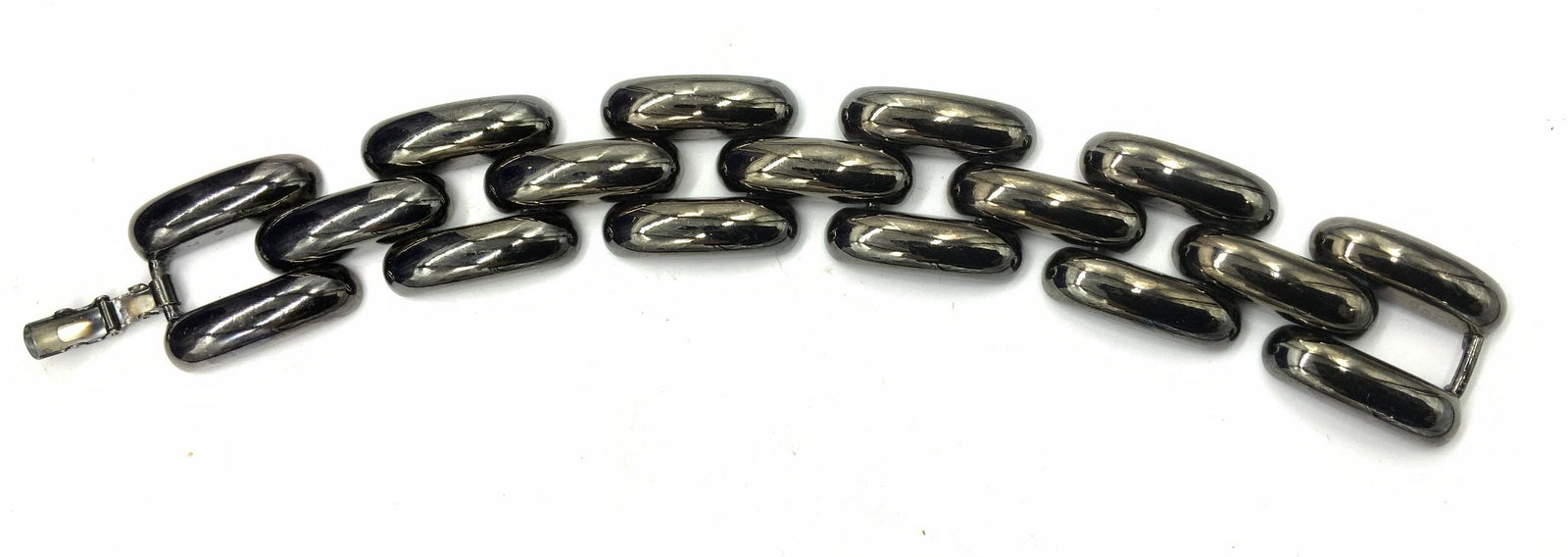 Chunky Gunmetal Link Bracelet, RLM Jewelry: Polished Gunmetal Link Bracelet, 1 in. Width 7.5 in. Long, secure box clasp, no mark. ROBERT LEE MORRIS When RBL Artwear opened in 1977, the store instantly became a part of the happening New York Cit