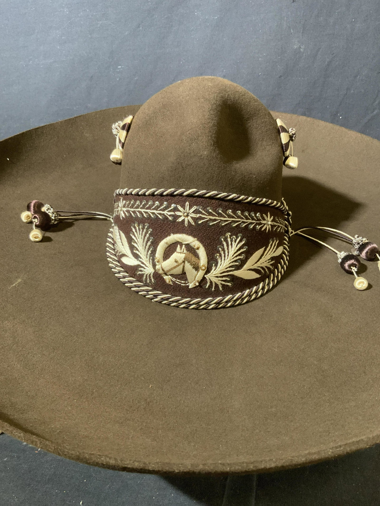 TARDAN Mariachi Sombrero in Vintage Box: TARDAN Mariachi Sombrero, tag reads ‘Tardan’, sombrero is brown with decorative work at crown with a profile of a horse, measures approx 21 inches in diameter, head piece measures 8 inches long an