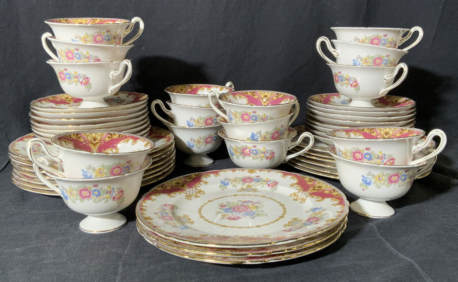Shelley Fine Bone China Tea Set 48, England: Vintage mid century English fine bone china Shelley teacups and saucers and Luncheon plates in their red floral ‘Sheraton’ pattern. Marked on verso ‘Fine Bone China Shelley England Sheraton 1328