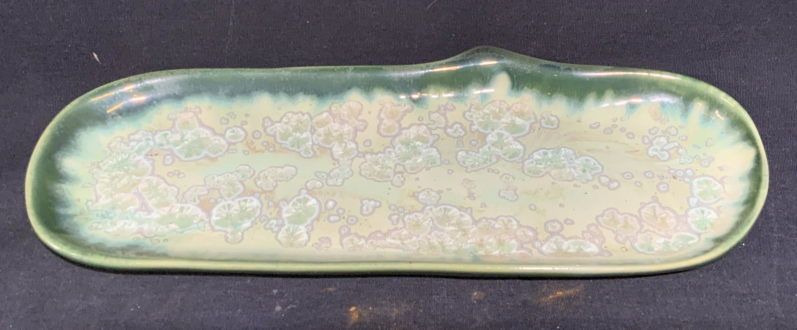 Ceramic Amoeba Patterned Dish: Ceramic Amoeba Patterned Dish / Ashtray, hallmark to base reads ‘A’, hued green with amoeba like pattern, measures 11 l x 4 3/8 w inches, wear consistent with age and use. Ceramic, ceramic ware, g