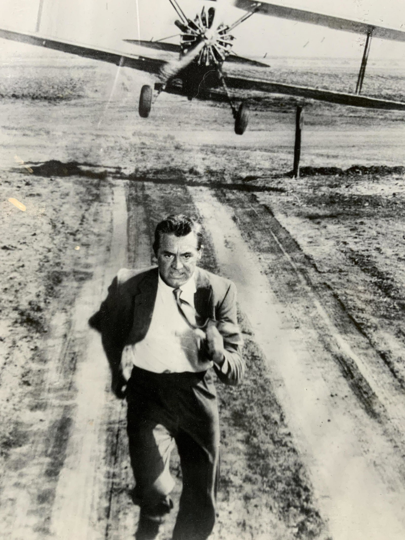 Saint North and Northwest Framed Still: Saint North and Northwest Framed Still, no apparent inscriptions or mark to piece, subject a still from the movie Saint North and Northwest plane scene, frame measures 8 x 10 inches, framed in black a