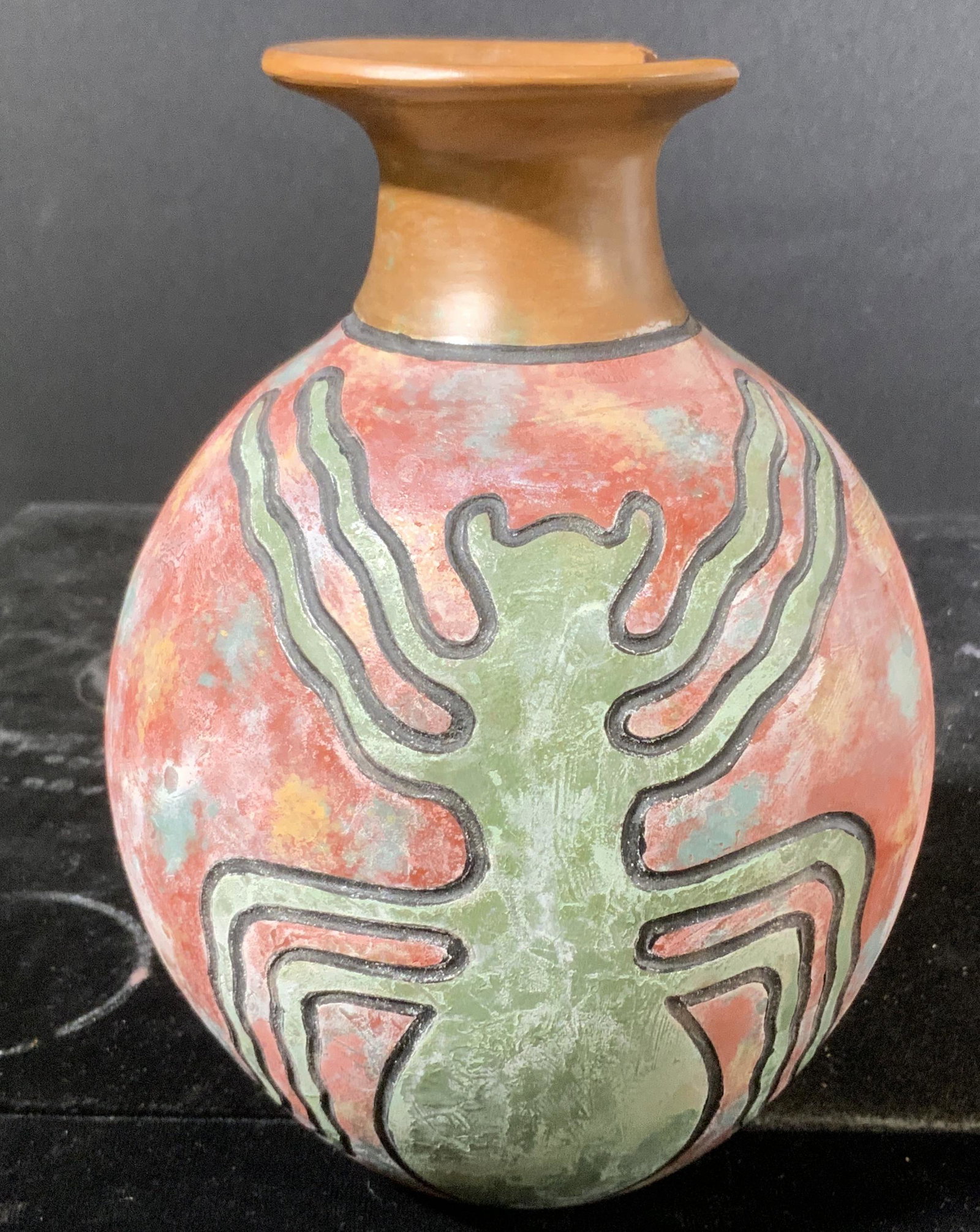 Nazca Line Earthenware Pottery: Signed earthenware bottle. Rim is chipped. Depicts the spider nazca lines, pottery is hand painted. Underside is signed TALLER MONCADA. Wear is consistent with age and use. Measures approx 7 inches h 