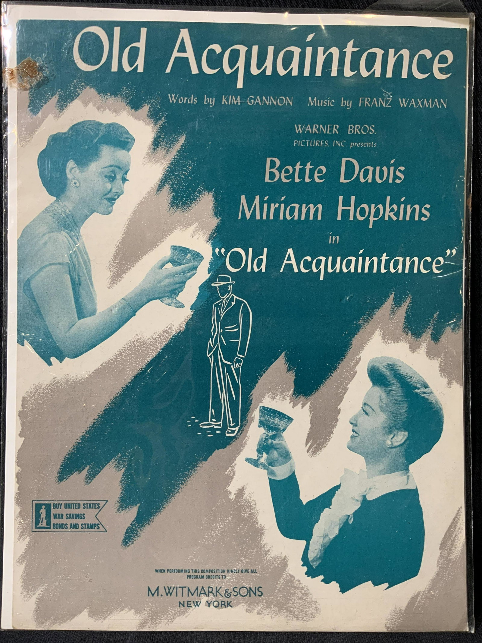 Old Acquaintance Advertisement: Old Acquaintance Advertisement, marking to lower center reads ‘M. WITMARK & SONS’, subject a teal toned poster with two women tipping glasses toward each other, not framed, measures 9 x 12 inches,