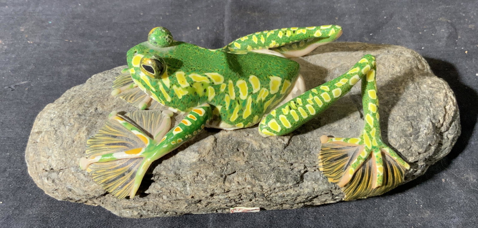 Modeled Frog on Rock: Modeled Frog on Rock, no apparent inscriptions or mark to piece, subject a green frog mounted on a rock, measures 8 x 3 x 4 inches, surface wear to piece. Artwork, fine art, tabletop art, tabletop dec