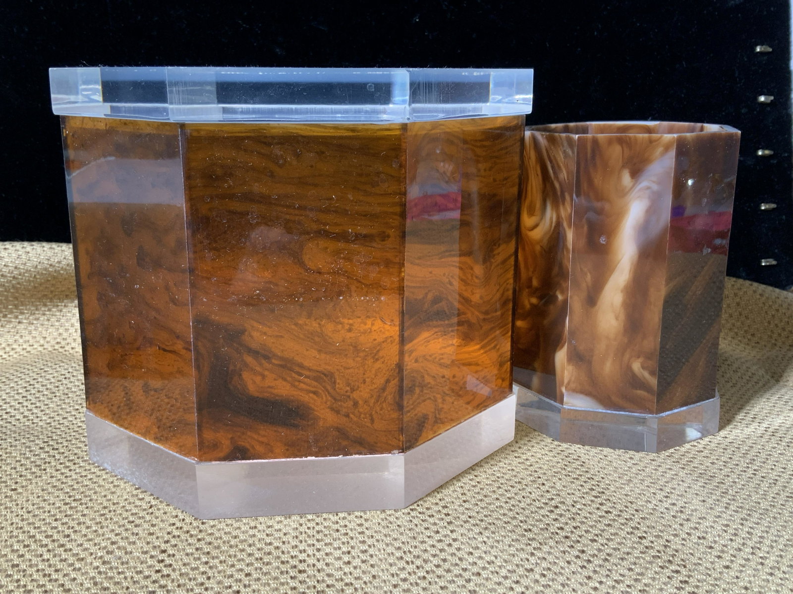 MCM Lucite/ Composite Vanity Pair: Mid century Marbled Brown and clear lucite bathroom Cotton Ball Storage Box with lid and tooth brush holder/ bathroom drinking cup. Pieces are lidded box measures app 6.25 in ht, 5.25 in. Width. Vinta