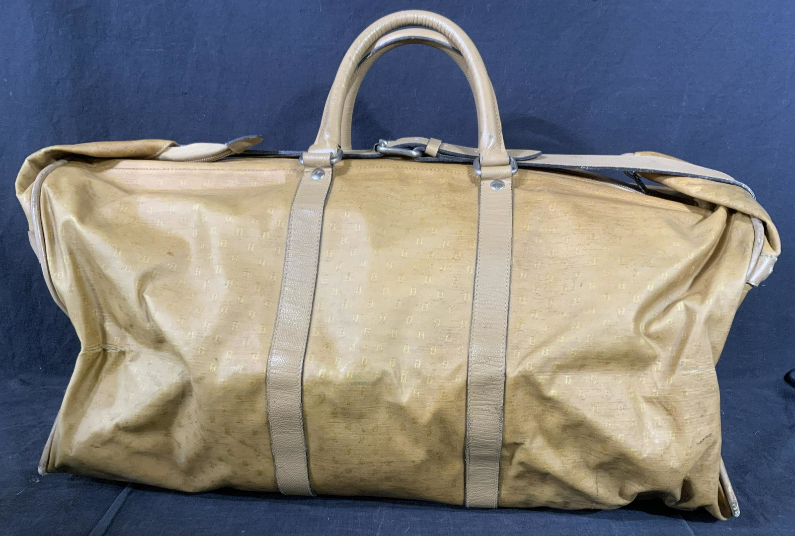 Vintage FENDI Duffel Bag: Vintage FENDI Duffel Bag. Interior label reads as FEMI SAS ROMA, MADE IN ITALY. Zips shut, secures with a leather strap, two handles on top. Measures approx 18 inches h and 32 inches w. Duffel bag, lu