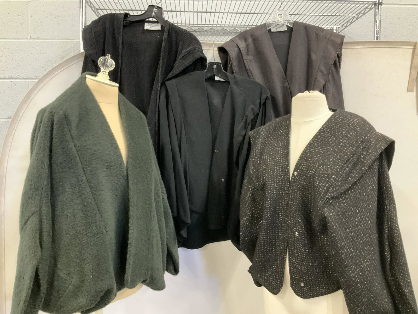JEANNE SCANNELL Plus Size Draped Cardigans, 5: All signed designer Jeanne Scannell. These are front snap cardigans with draped sleeves. Some are dressier fabrics and looks than others. Average size Fits XL/ 1X . Black with gold thread has puncture