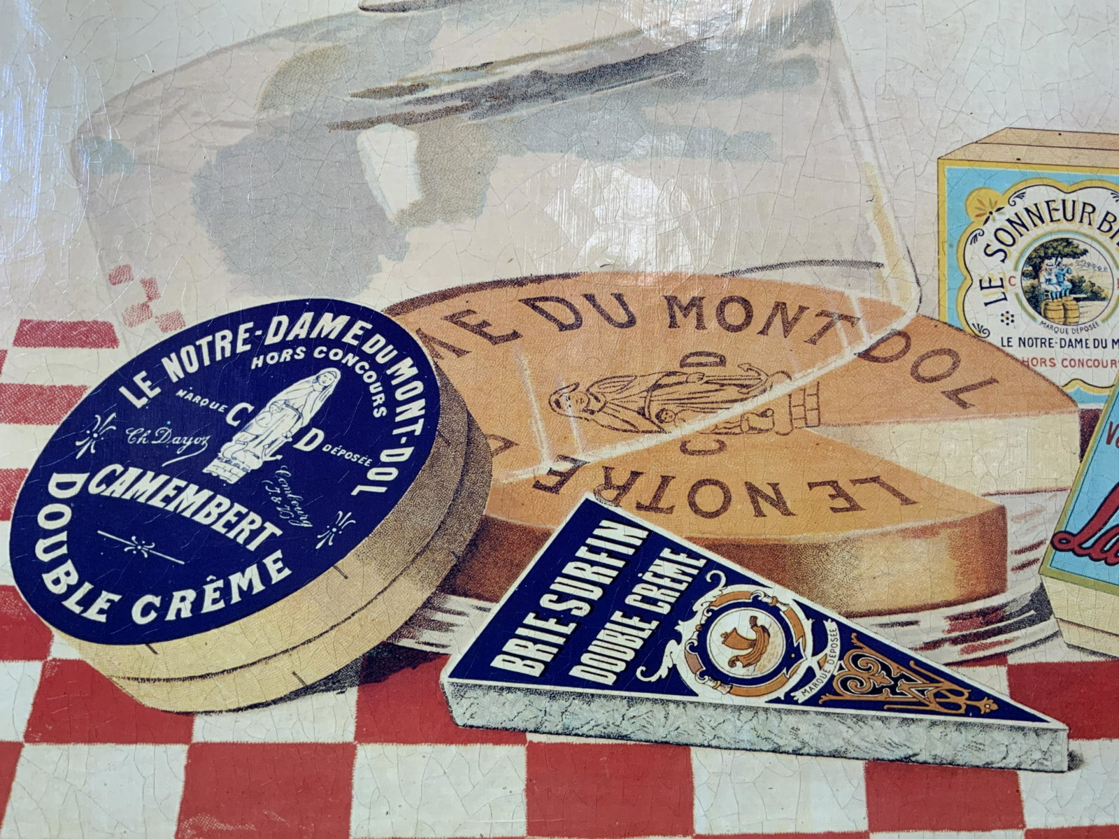 PMA Assorted Cheeses Serigraph on Stretched Canvas: PMA Assorted Cheeses Serigraph on Stretched Canvas, signature to lower right reads ‘PMA’, subject an assortment of cheese on a red and white checked table cloth, measures 25 1/2 x 17 1/2 inches, n