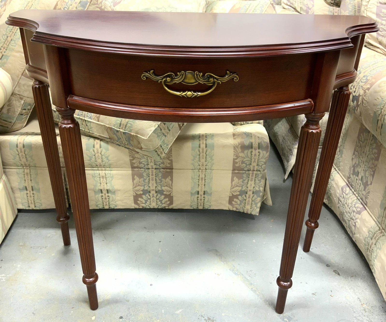 BOMBAY Wooden Entryway Table: Underside of piece has tag which reads BOMBAY. Piece is mahogany toned and wooden. Piece is wooden. Table measures approx 29.5 inches h, 35 inches w, 15 inches deep. Table, entryway table, Bombay tabl