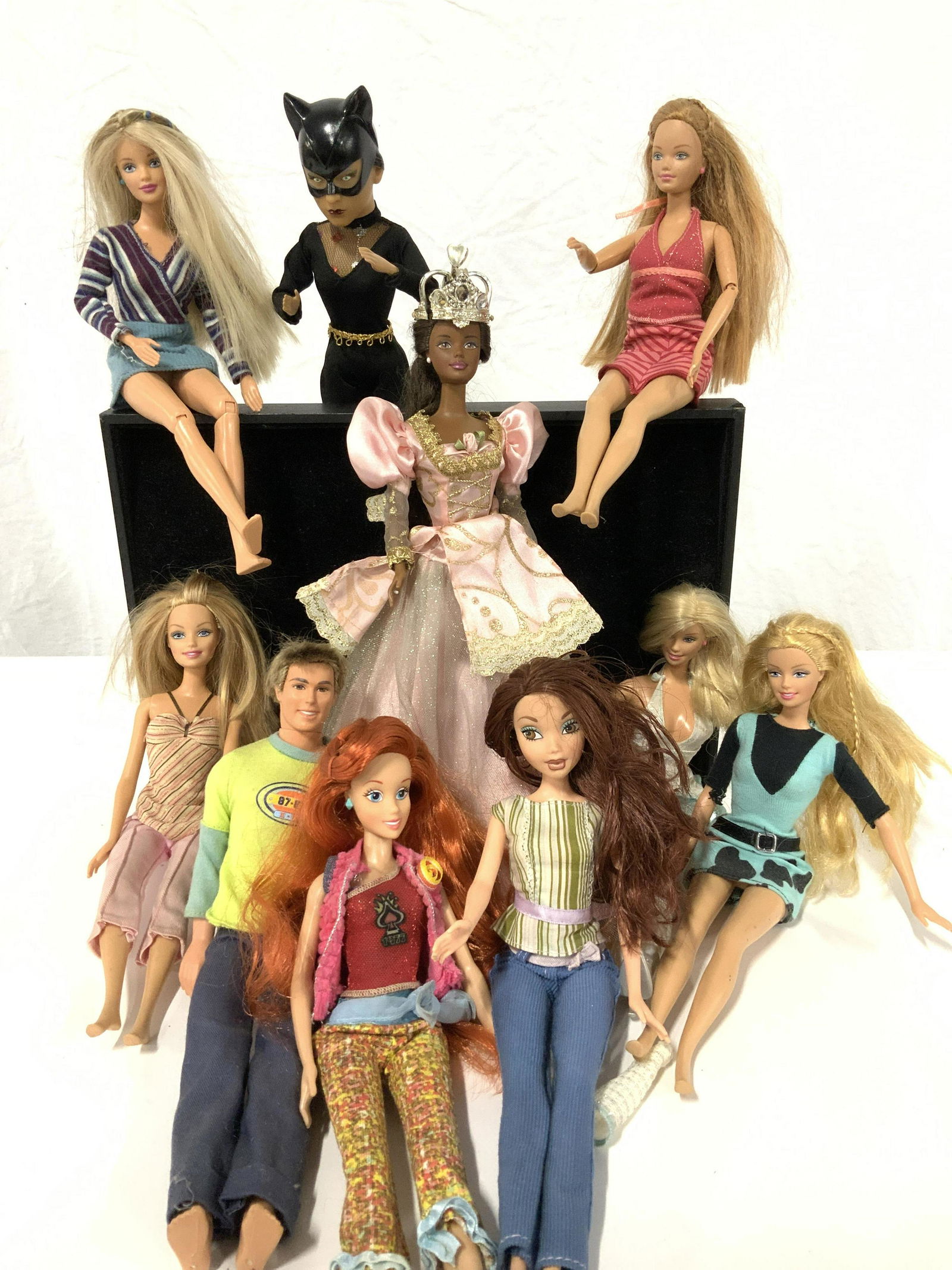 Grp 10 Collectible Vintage Barbie & Dolls: Variety of Mattel Barbies, Ken and Other dolls , most stamped on doll and dated. Highlight include 1968 Ken Mattel Barbie, Cat Woman doll with costume Mask of cat woman, 1966 African American Rapunzel