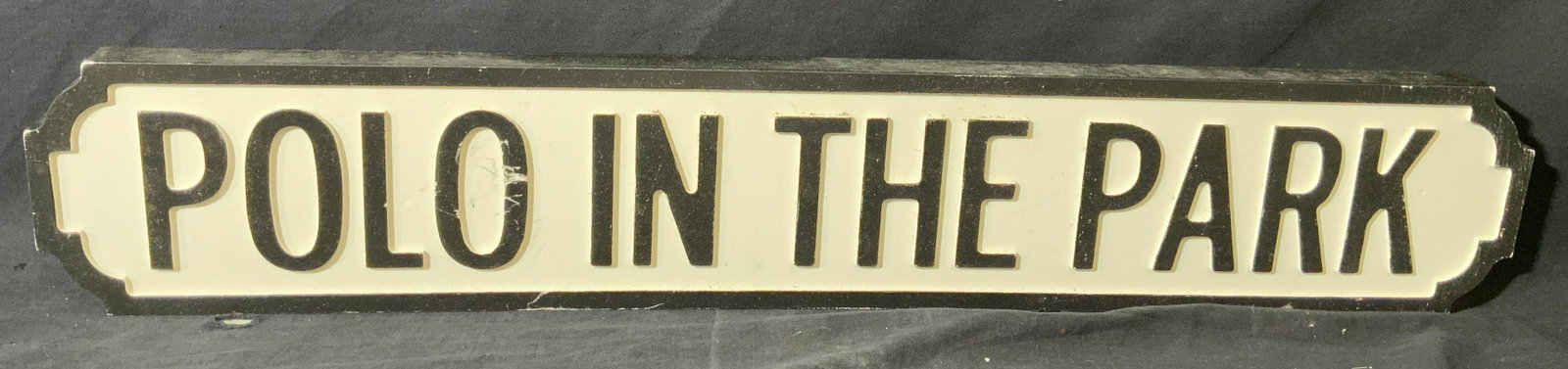 Polo in the Park Sign: Polo in the Park Sign, sign reads â€˜POLO IN THE PARKâ€™, wooden sign, measures 31 x 5 1/2 inches, surface wear to piece. Sign, street sign, polo, polo sport, playing polo, park games, polo i