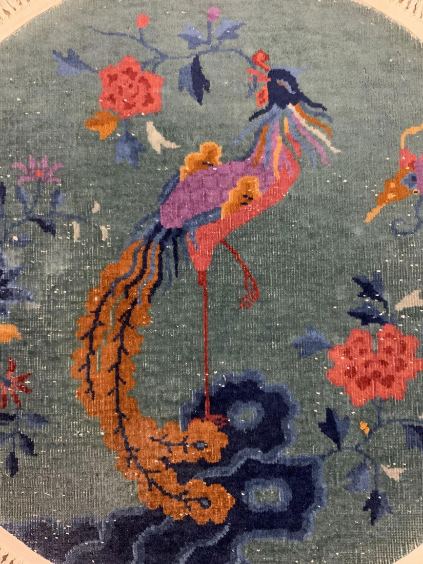 Vtg Circular Handmade Chinese Art Deco Rug: Rug is vintage possibly antique. Piece is handmade and wool. Rug has multi toned floral, leaf, butterfly & bird detail. . Piece measures approx 40 inches diameter with fringes. Rug, Chinese Art Deco r