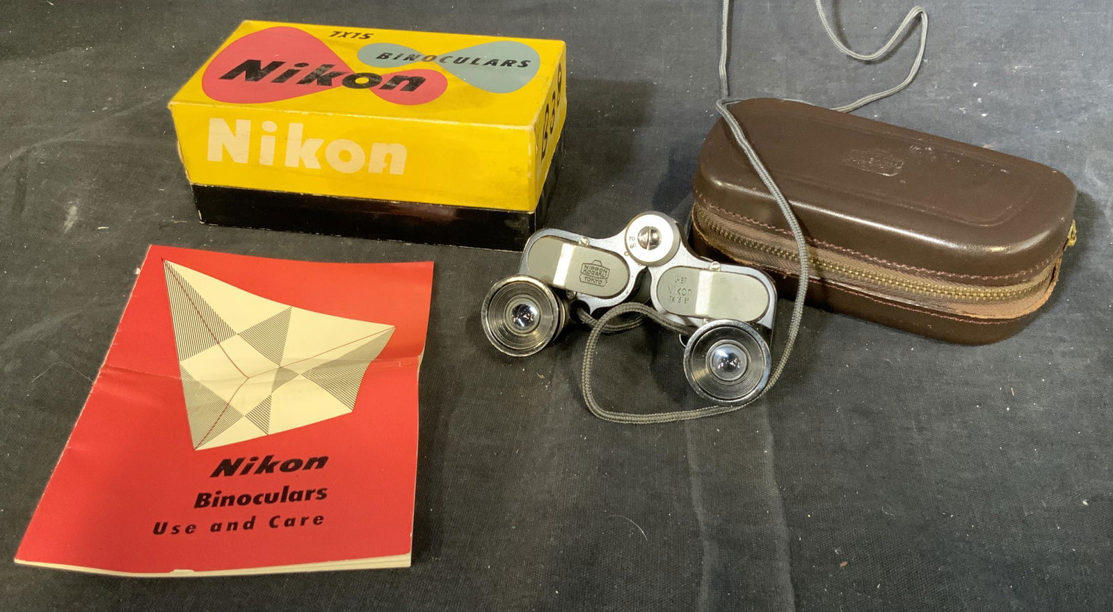 Vintage Nikon 7X15 Binoculars: Vintage Nikon 7X15 Binoculars In box, measures 3 1/4 x 1 3/4 inches, wear consistent with age and use. binoculars, binoculars, vintage binoculars, whale watching, bird watching, sightseeing, hiking ac