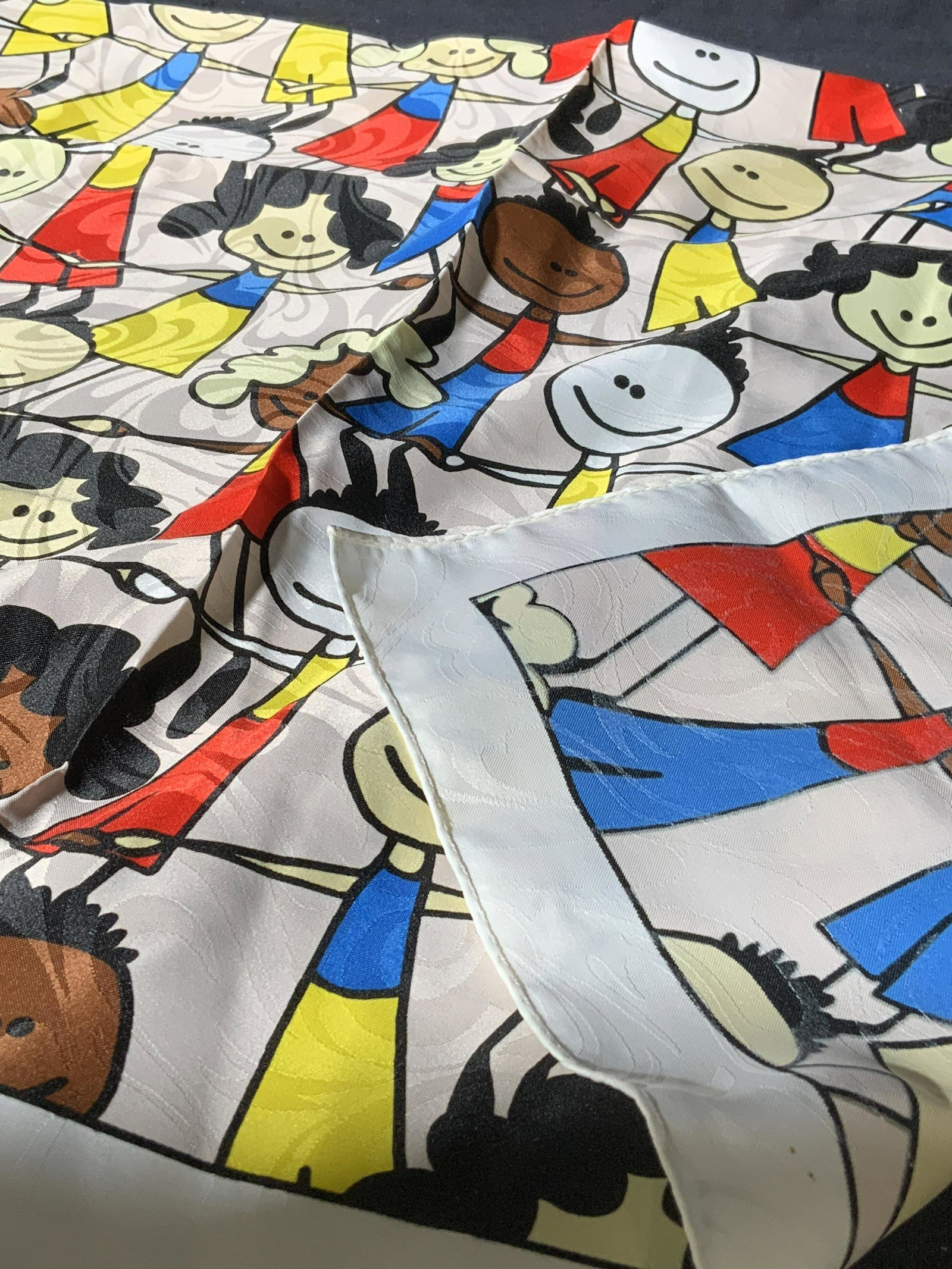 Vintage Hand Rolled Polyester Scarf: Vintage Hand Rolled Polyester Scarf, shows children holding hands in alternating pattern, measures 29 1/2 x 29 1/2, wear consistent with age and use, small discolored spots to bottom right and few pul