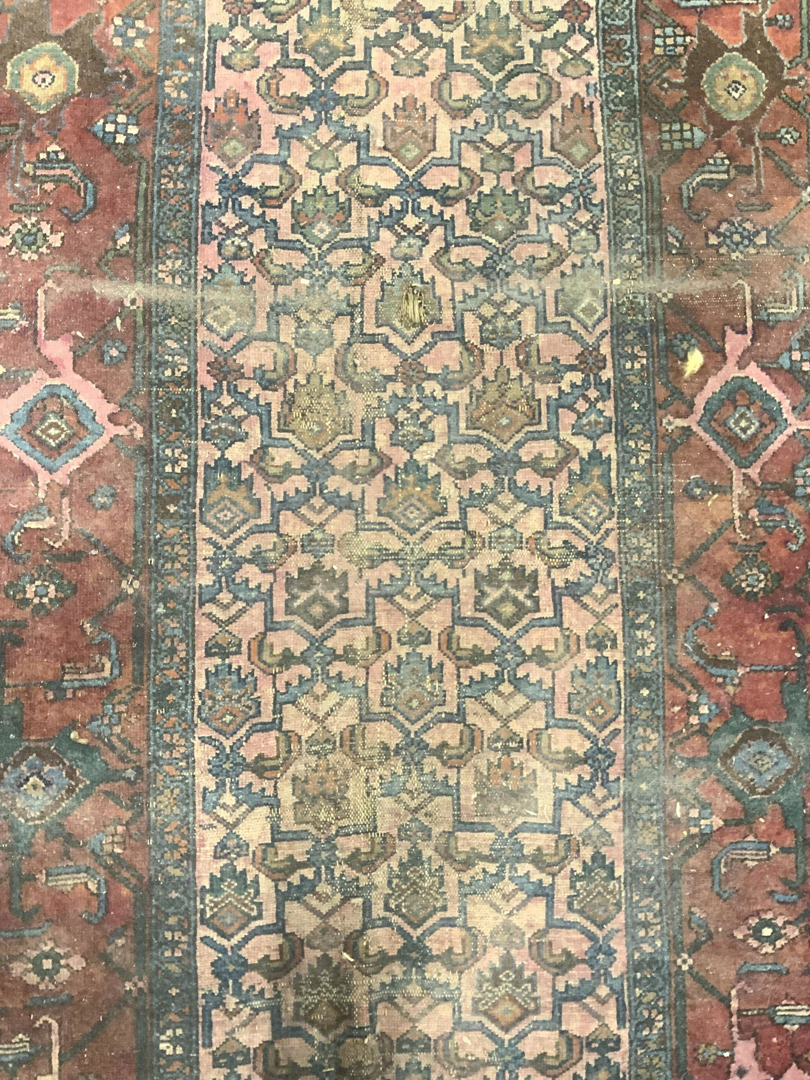 Antique Handmade Persian Wool Area Rug: Rug is antique. Piece is handmade and wool. Piece has intricate multi toned floral, vine & leaf detail. Piece measures approx 81 inches long 47 inches wide. Rug, carpet, wool rug, antique rug, area ru