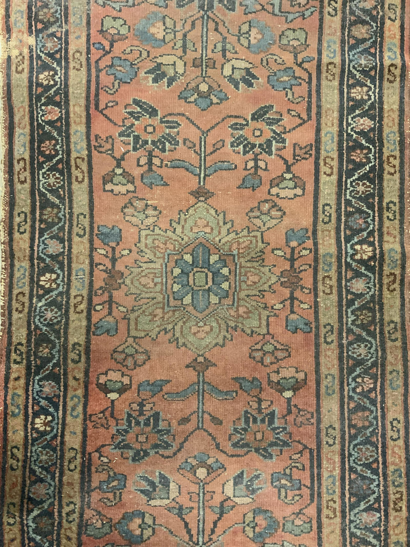 Antique Handmade Persian Wool Area Rug: Rug is antique. Piece is handmade and wool. Piece has intricate multi toned floral, vine & leaf detail. Piece measures approx 50 inches long 28 inches wide. Rug, carpet, wool rug, antique rug, area ru