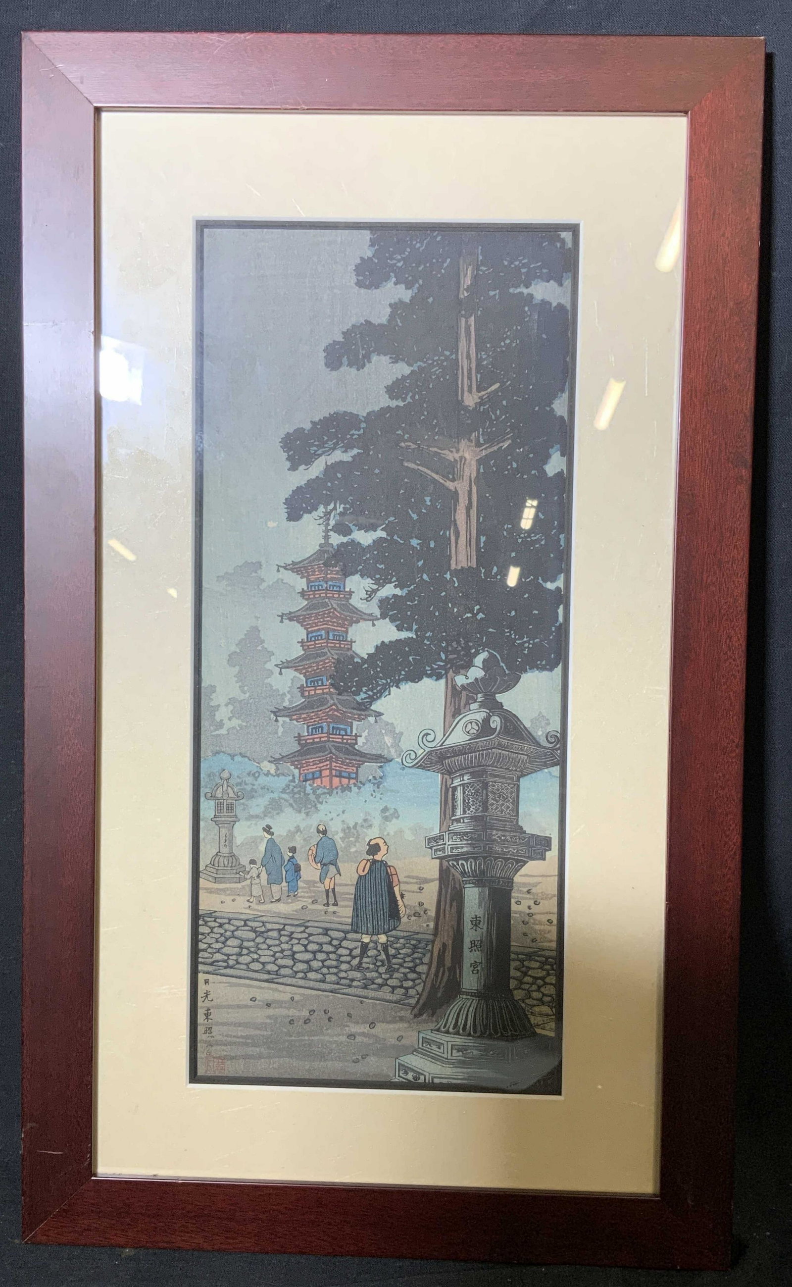 Japanese Woodblock of Temple: Japanese Woodblock Artwork, inscriptions illegible, subject a view of a temple with a family standing outside of it, measures 11 7/8 x 20 7/8 inches, window measures 6 1/2 x 15 inches, red mahogany wo