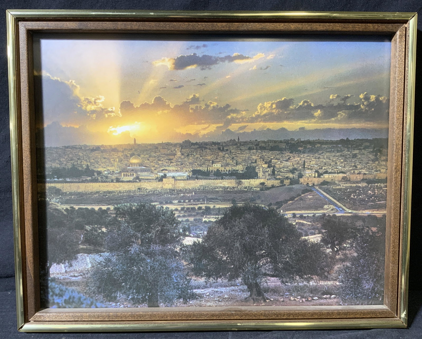 Lithograph of The Old City of Jerusalem Sunset: Lithograph of The Old City of Jerusalem Sunset, no apparent inscriptions or marks to piece, subject a photograph of the old city of Jerusalem from afar during sunset, frame measures 15 x 12 inches, fr