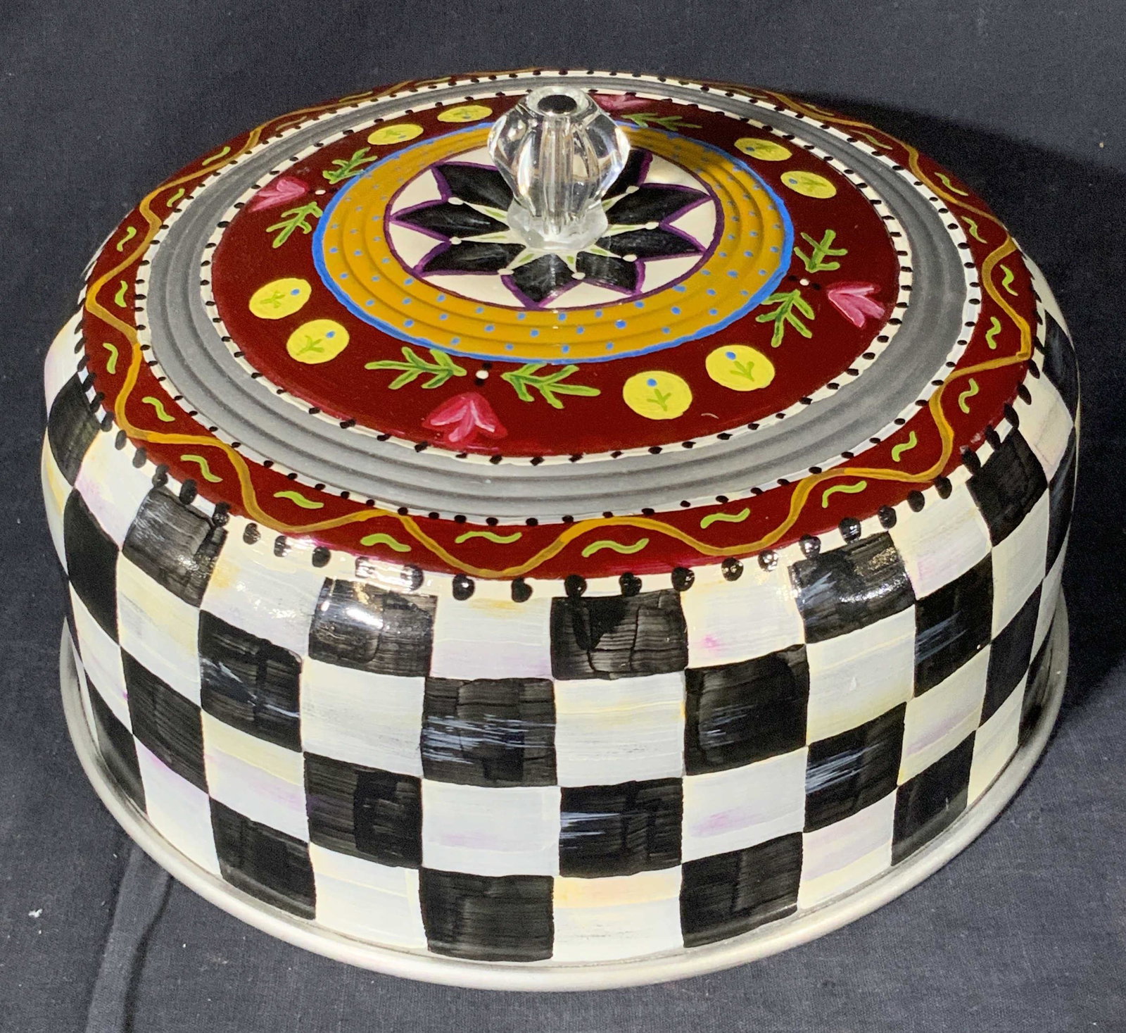 Vntg Hand Painted Metal Cloche Courtly Check Style: Mackenzie Childs Style silver tone metal cloche with colorful hand painted designs. Finial is a colorless acrylic style material. Measures approx 6.5H x 9W in. Measurement includes finial. Some wear t