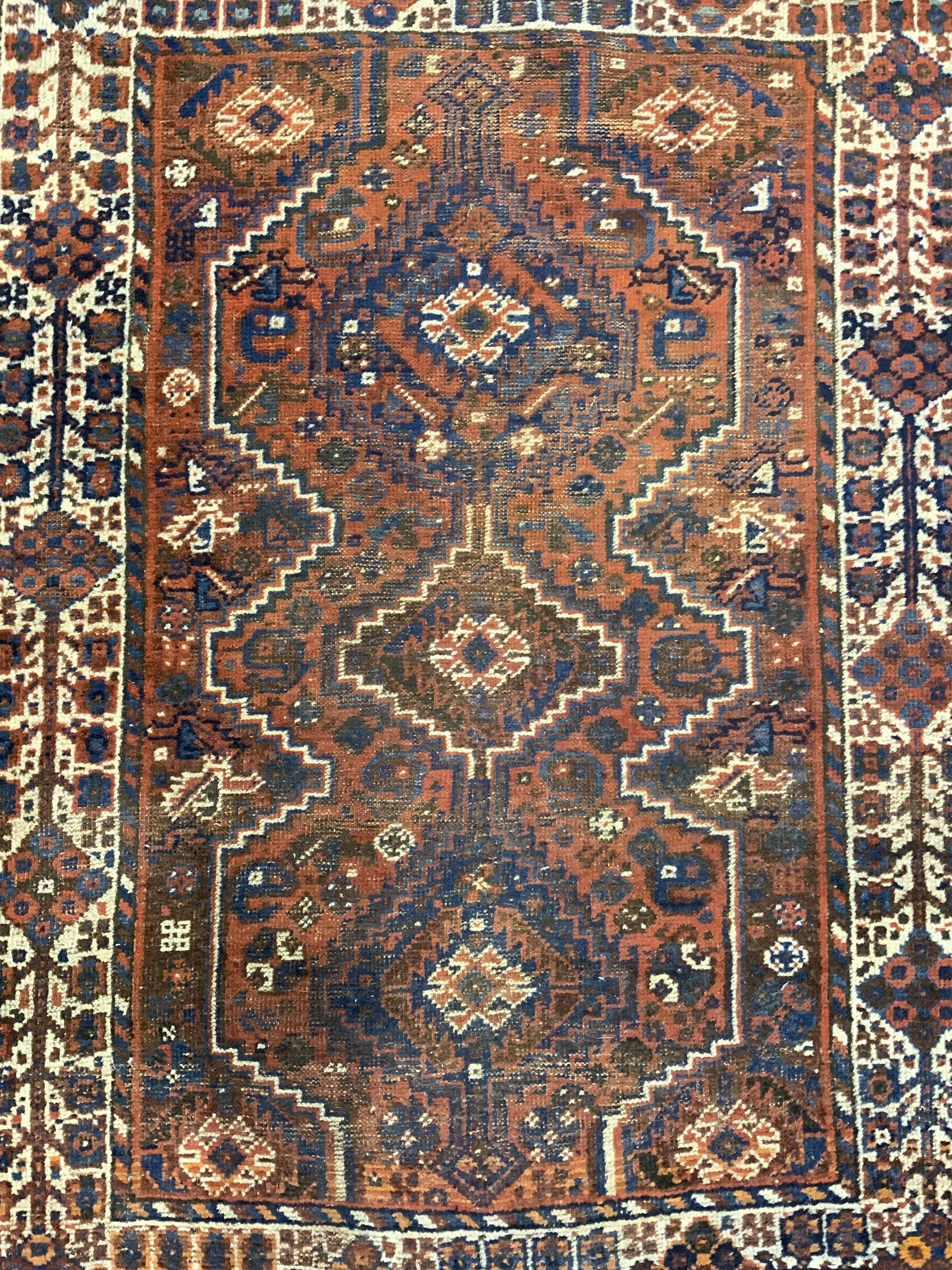 Vintage Handmade Turkish Wool Area Rug: Rug is handmade and wool. Piece is vintage possibly antique. Rug has intricate multi toned geometric detail. Piece appears to be Turkish. Rug has short fringes. Piece measures approx 64 inches long 46