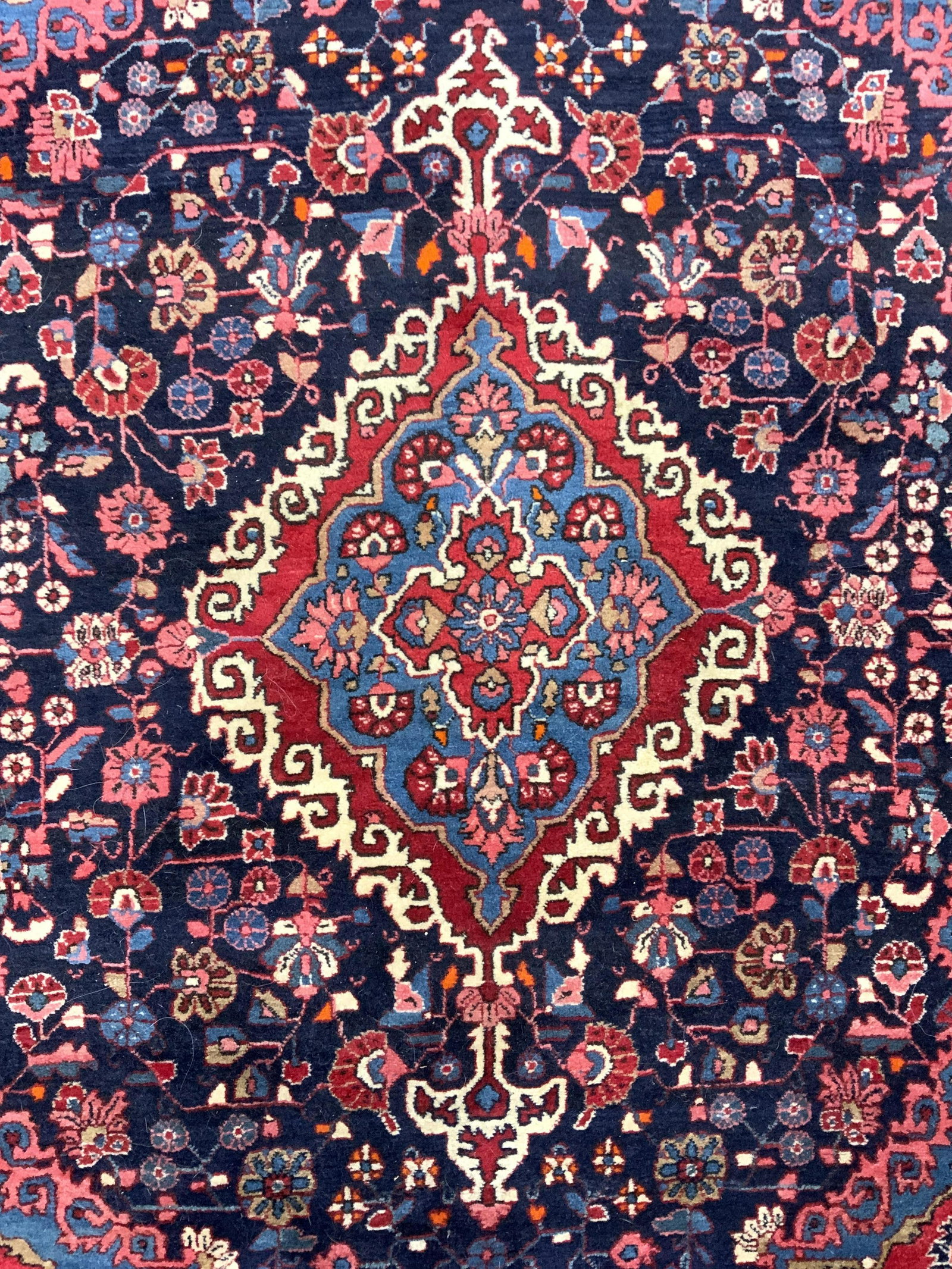 Vintage Handmade Persian Wool Area Rug: Rug is vintage. Piece has handmade and wool. Piece intricate handmade floral, vine and leaf detail. Rug appears to be Persian. Rug measures approx 64 inches long 40 inches wide. Rug, carpet, vintage r