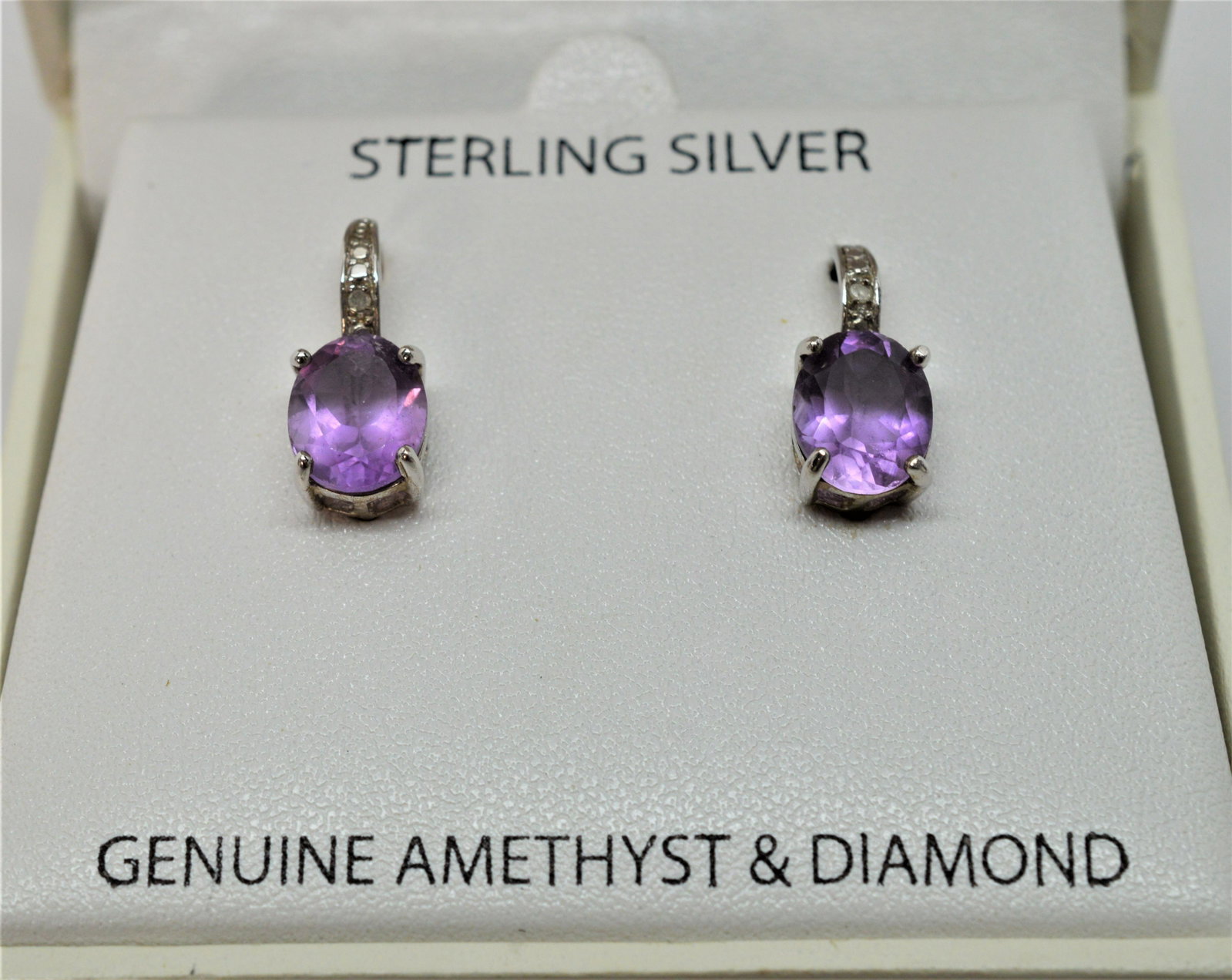 Victoria Townsend Amethyst and Diamond Earrings: New - Sterling Silver Jewelry from Victoria Townsend. Amethyst and Diamond Earrings. The Victoria Townsend earrings are amethyst and diamond with lever backs for pierced ears. New in box.
